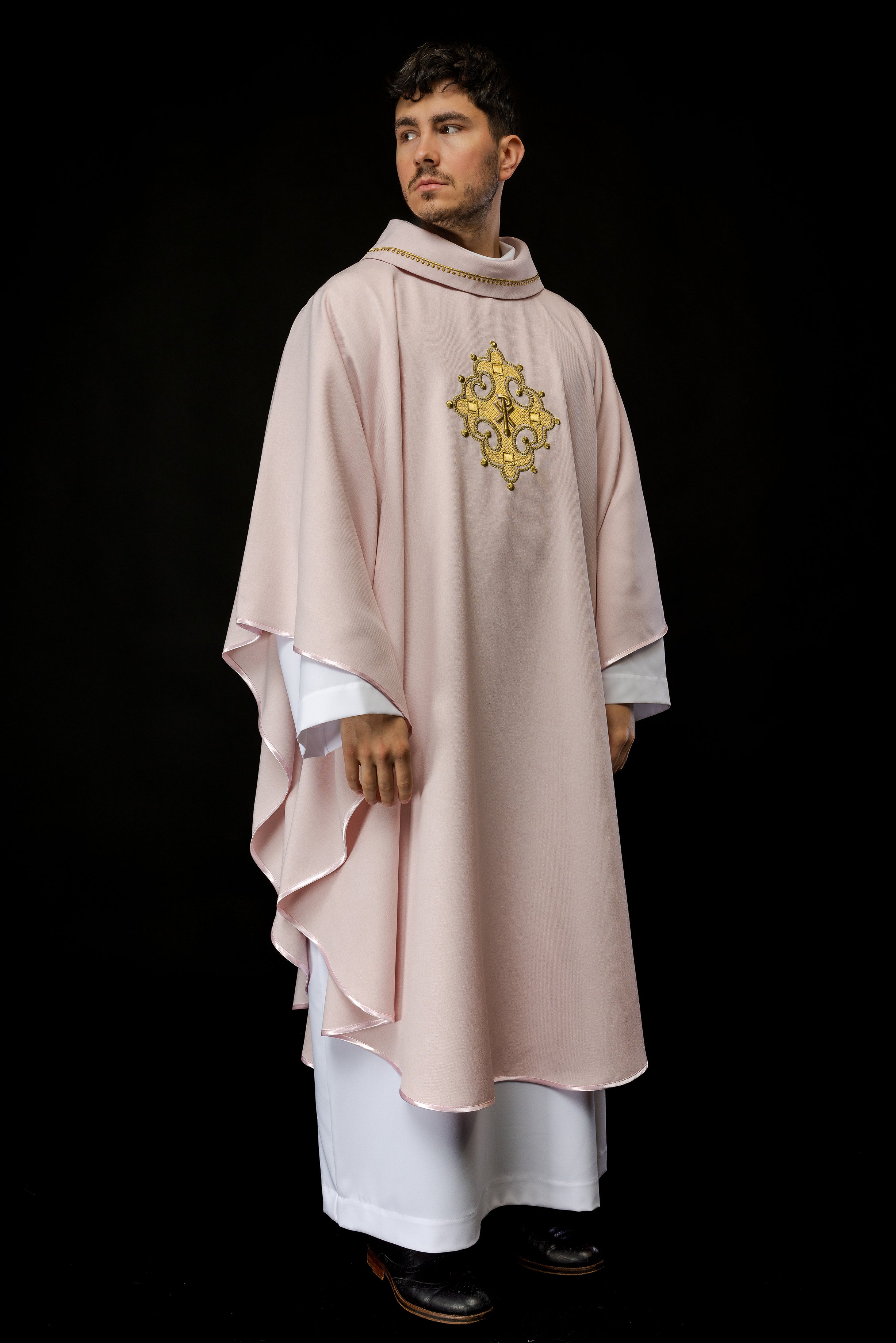 Simple pink chasuble with small PAX motif embroidery