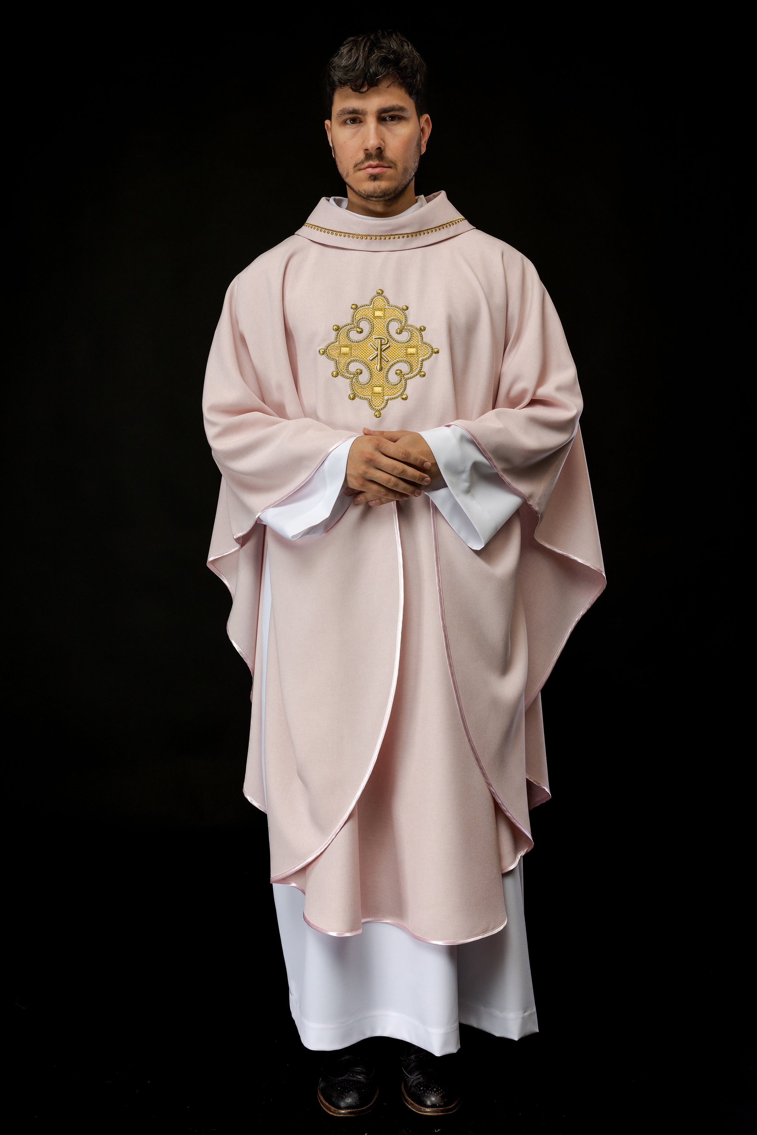 Simple pink chasuble with small PAX motif embroidery