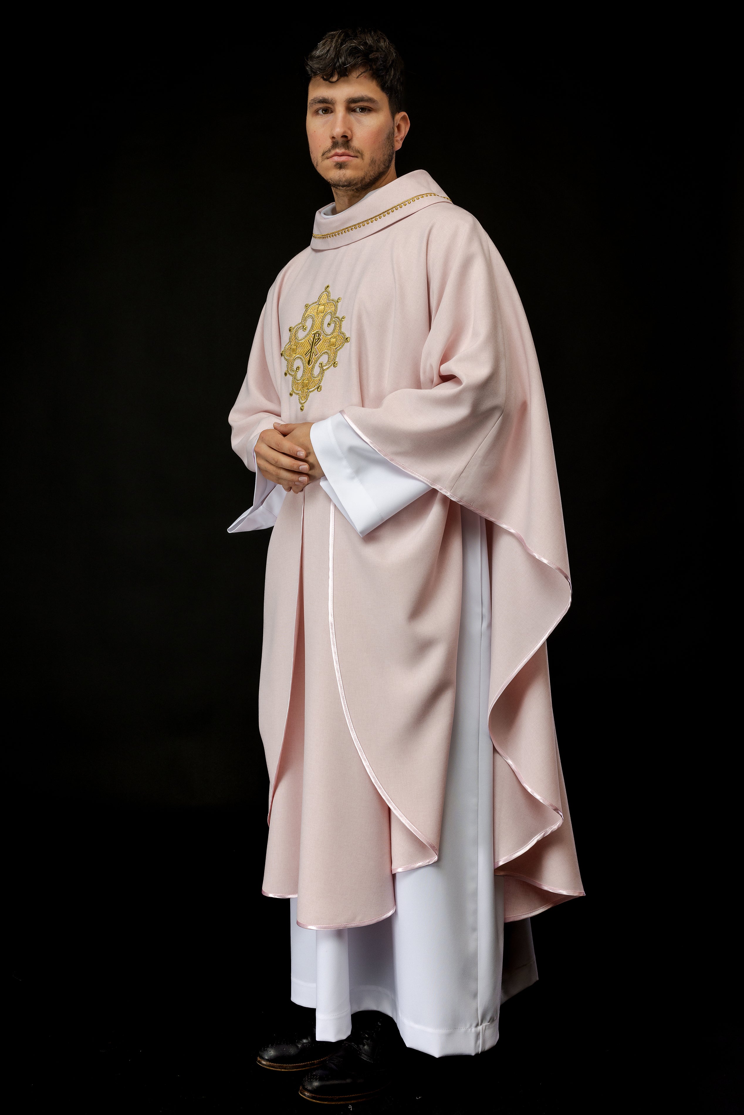 Simple pink chasuble with small PAX motif embroidery