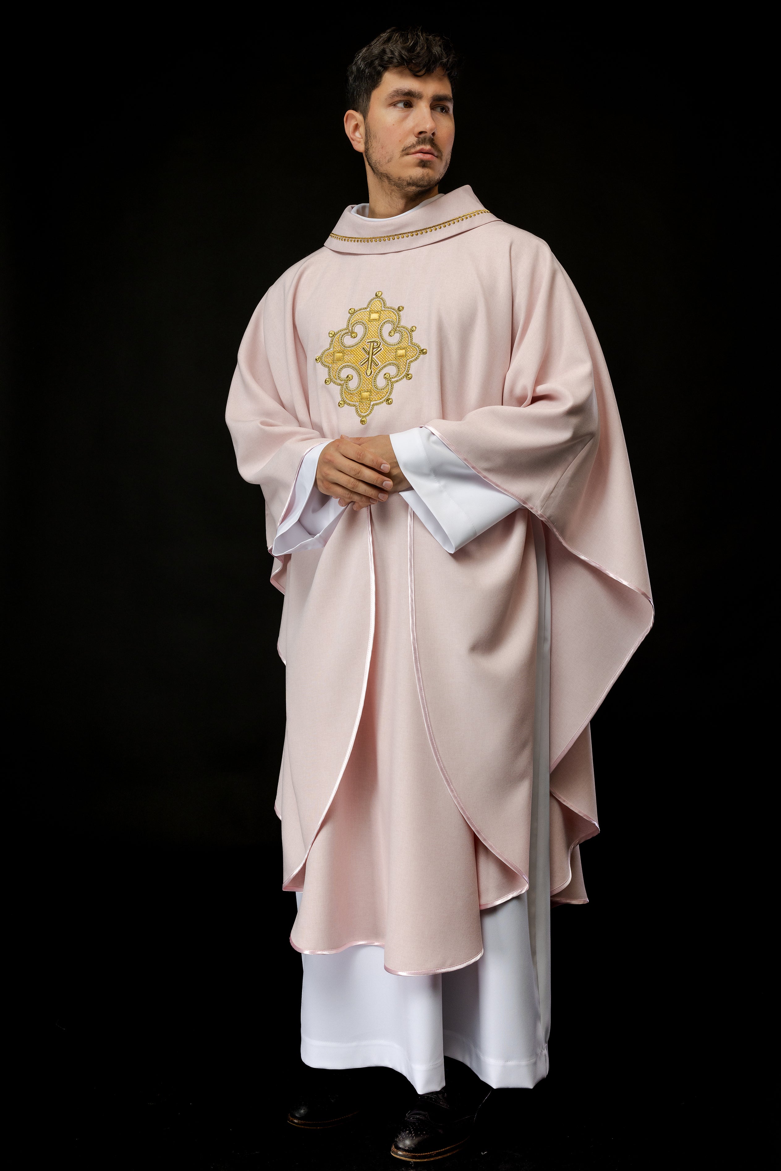 Simple pink chasuble with small PAX motif embroidery