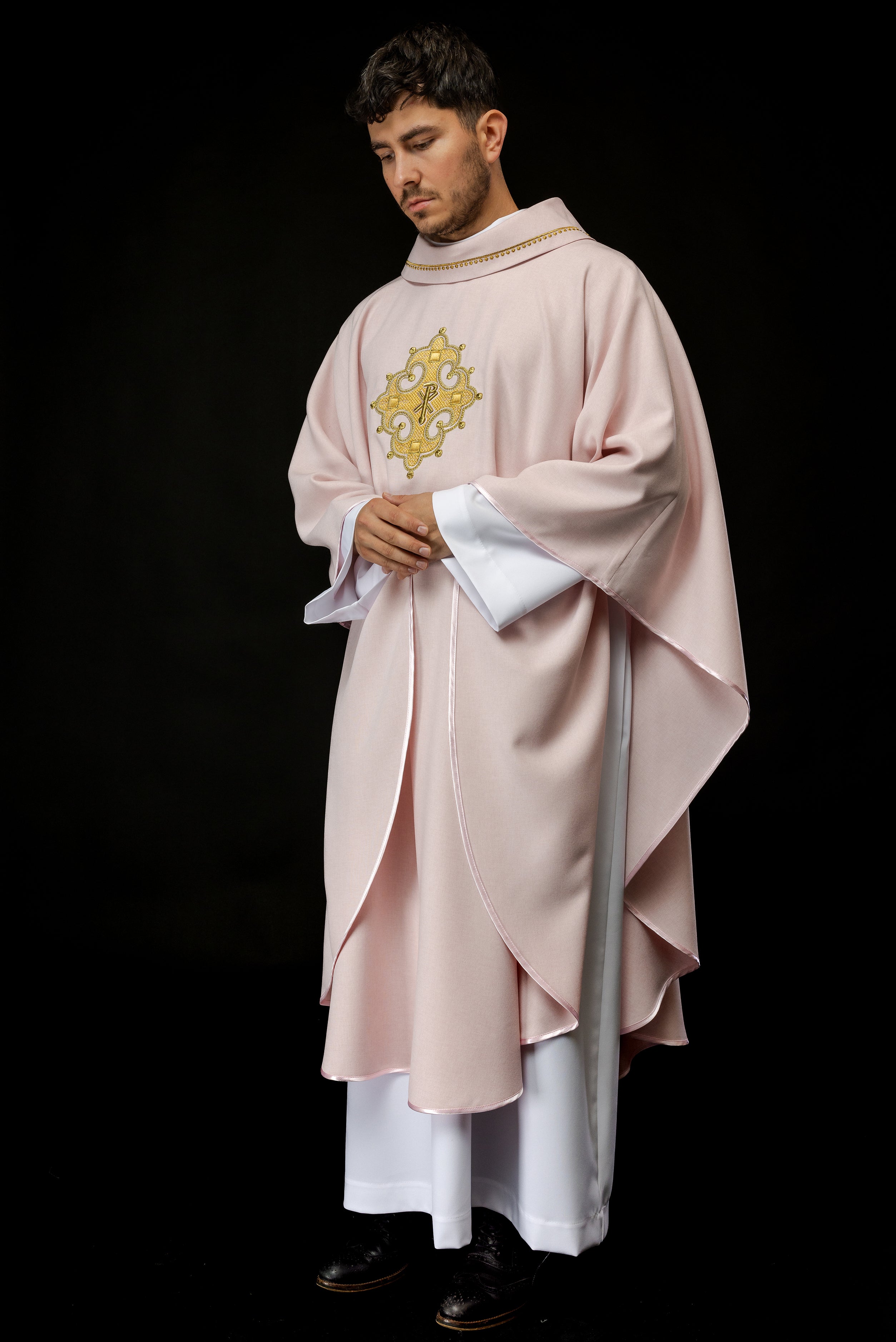 Simple pink chasuble with small PAX motif embroidery