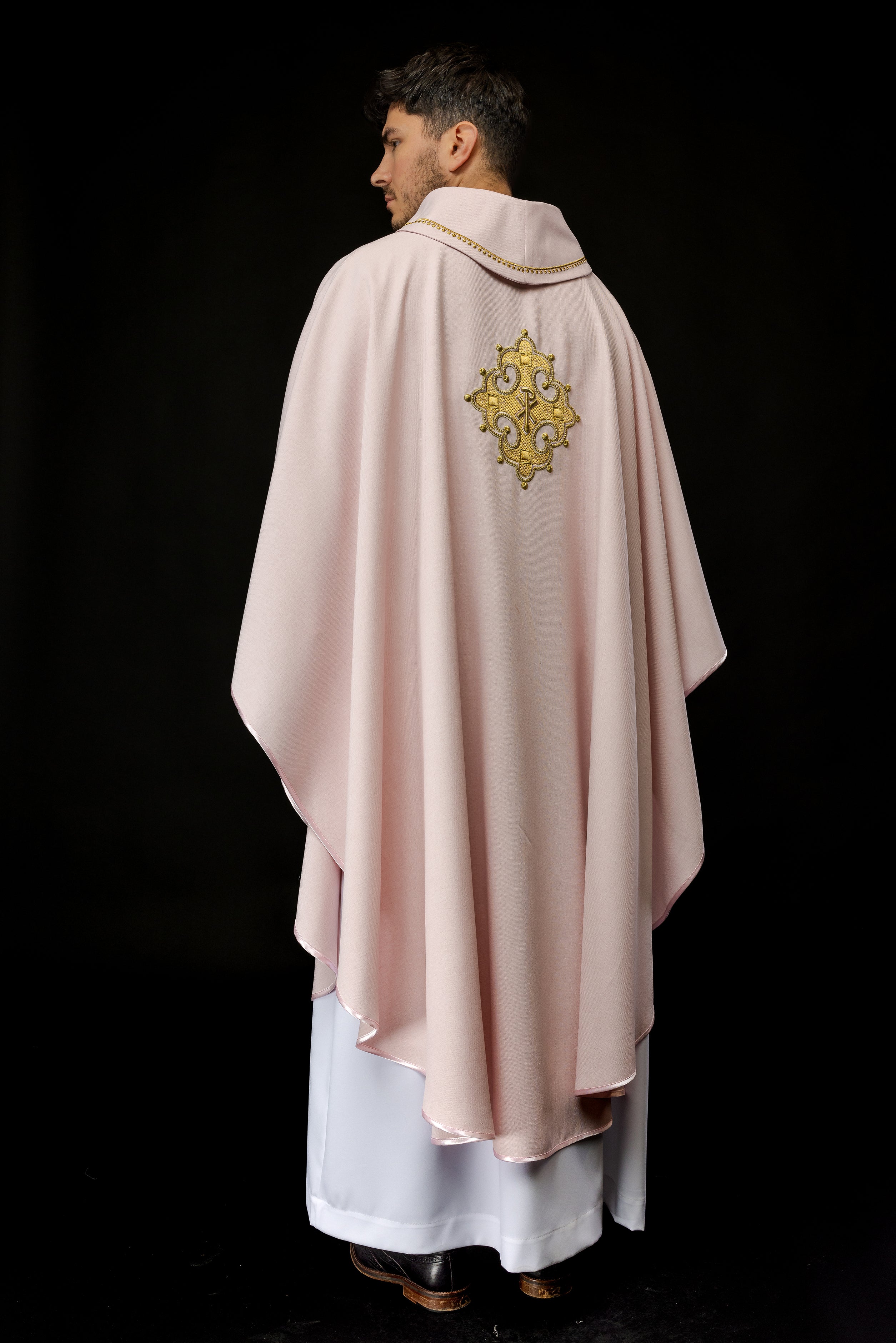 Simple pink chasuble with small PAX motif embroidery