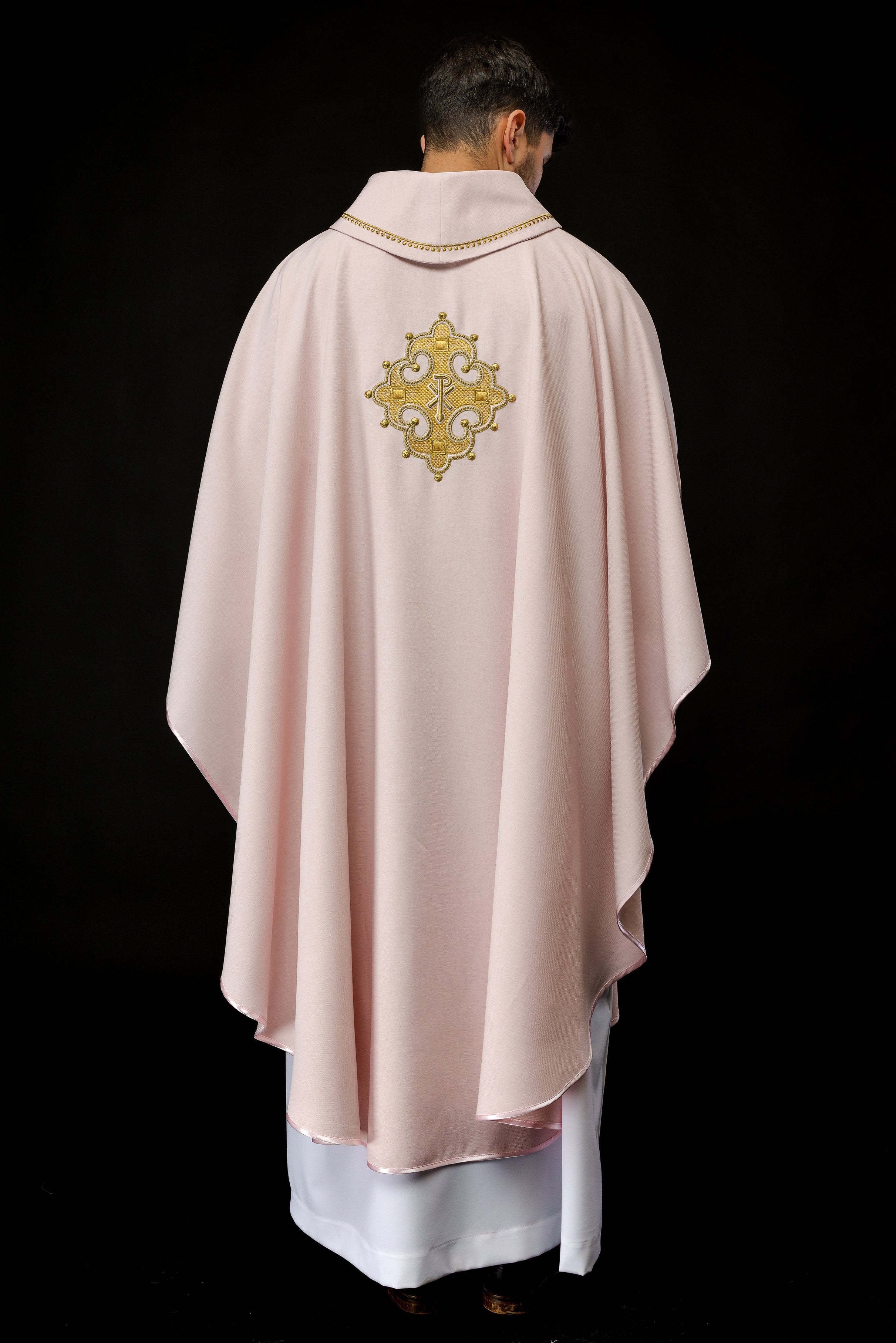 Simple pink chasuble with small PAX motif embroidery