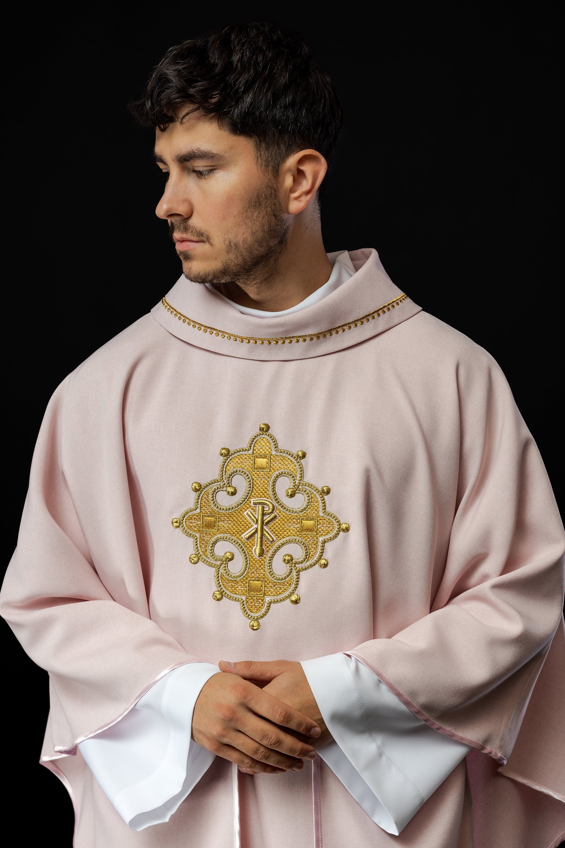 Simple pink chasuble with small PAX motif embroidery