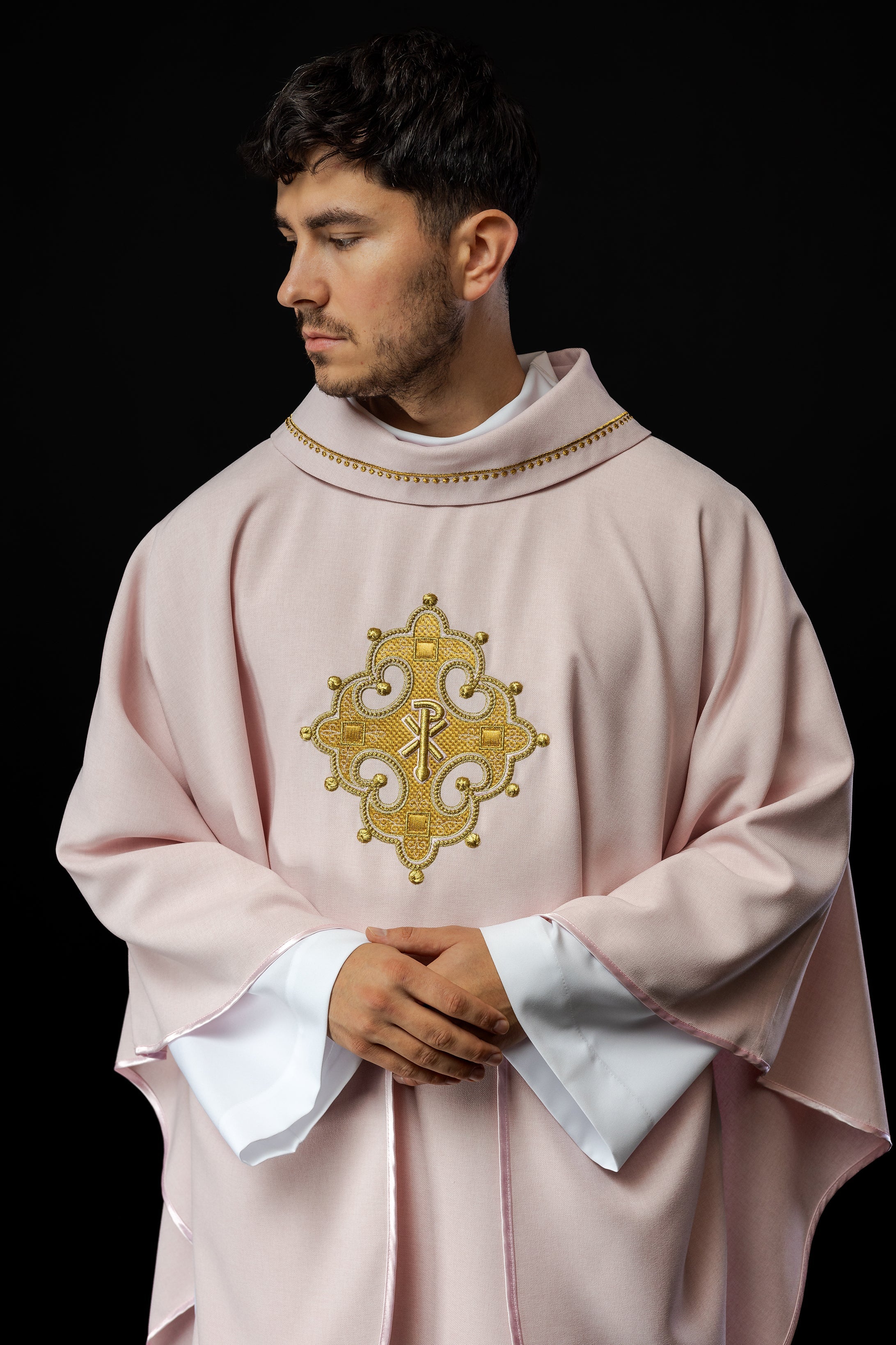 Simple pink chasuble with small PAX motif embroidery