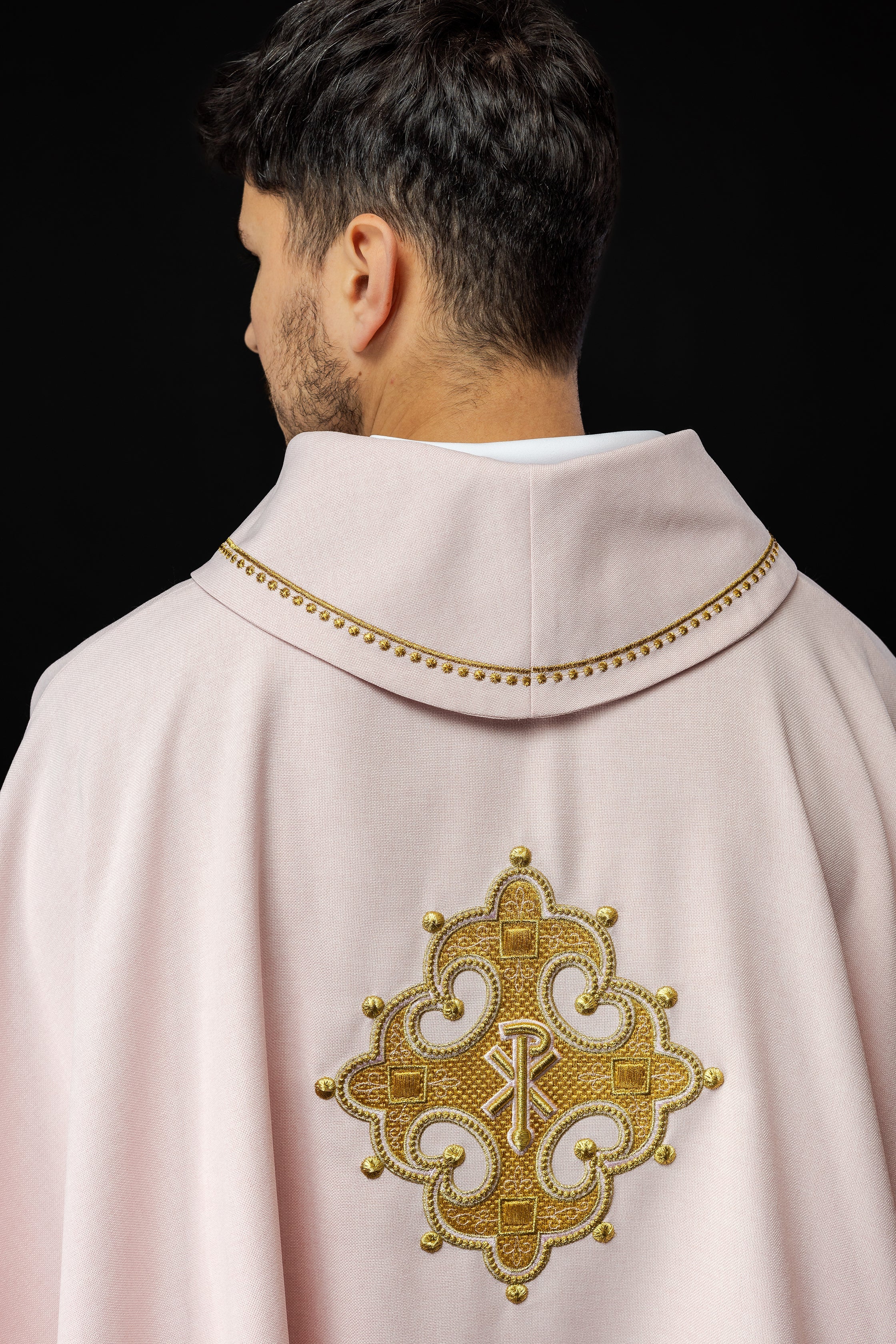 Simple pink chasuble with small PAX motif embroidery