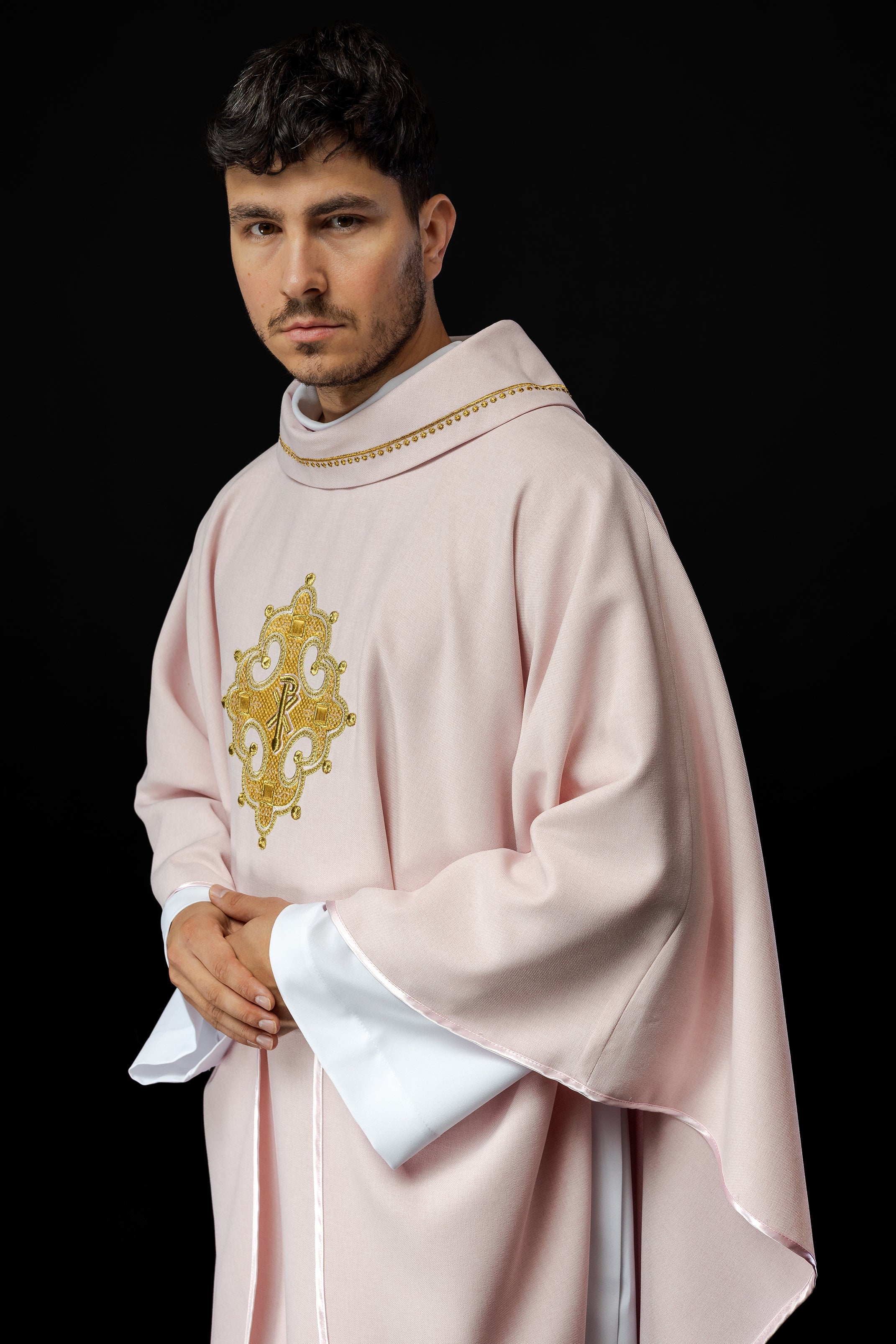 Simple pink chasuble with small PAX motif embroidery