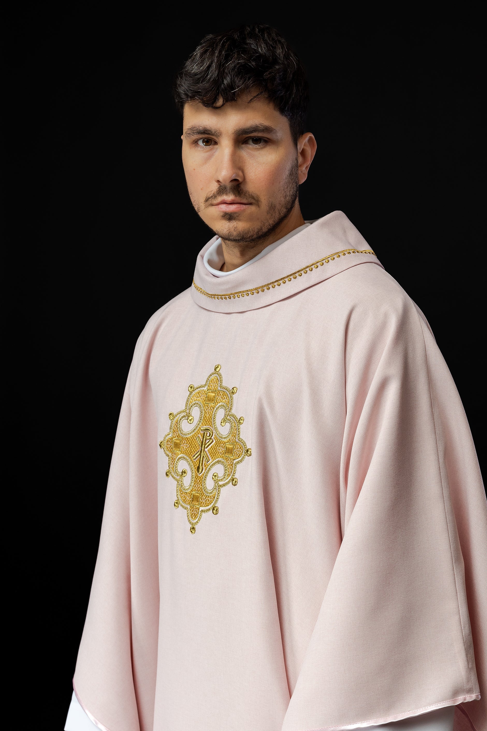 Simple pink chasuble with small PAX motif embroidery