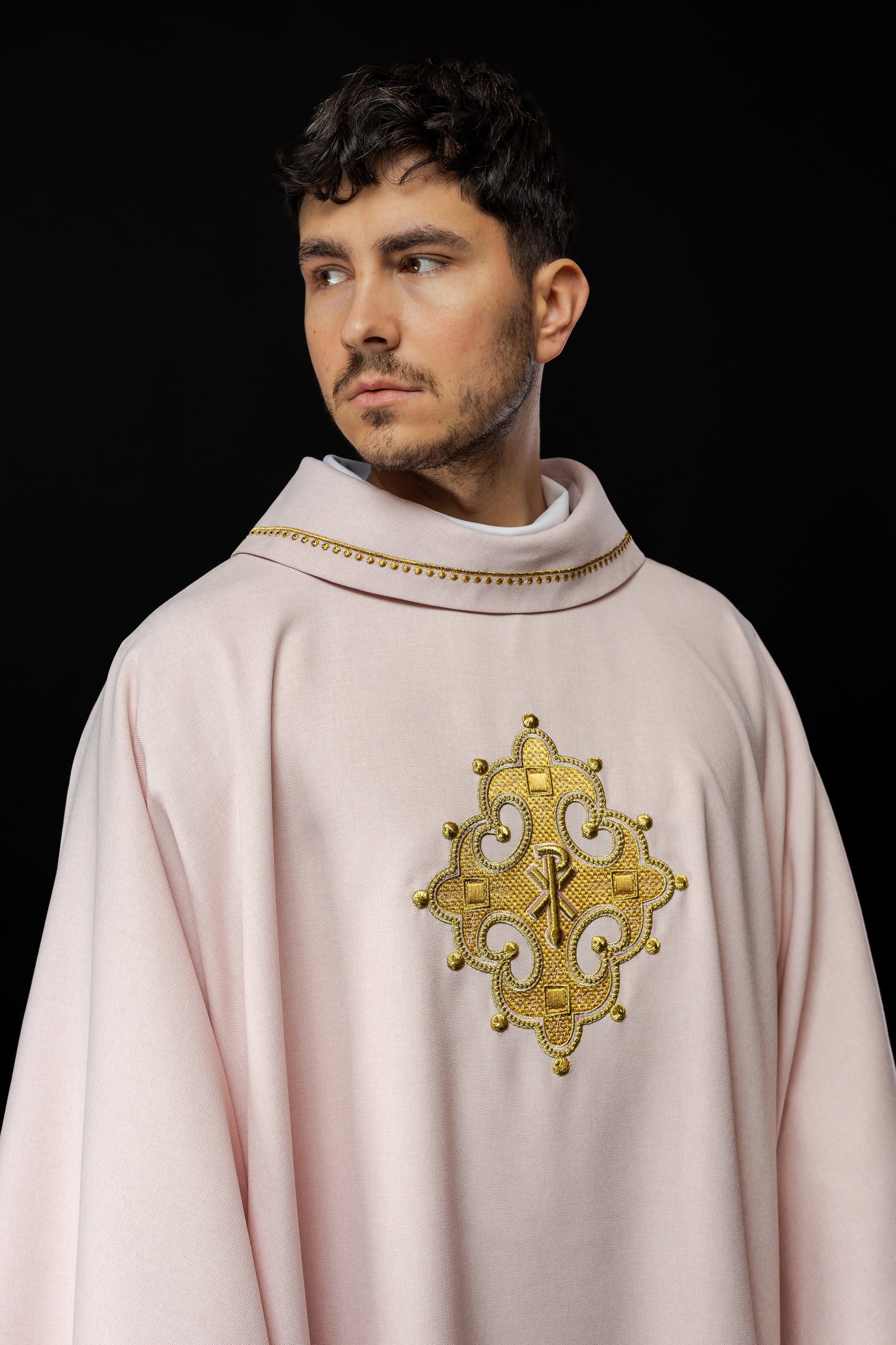 Simple pink chasuble with small PAX motif embroidery