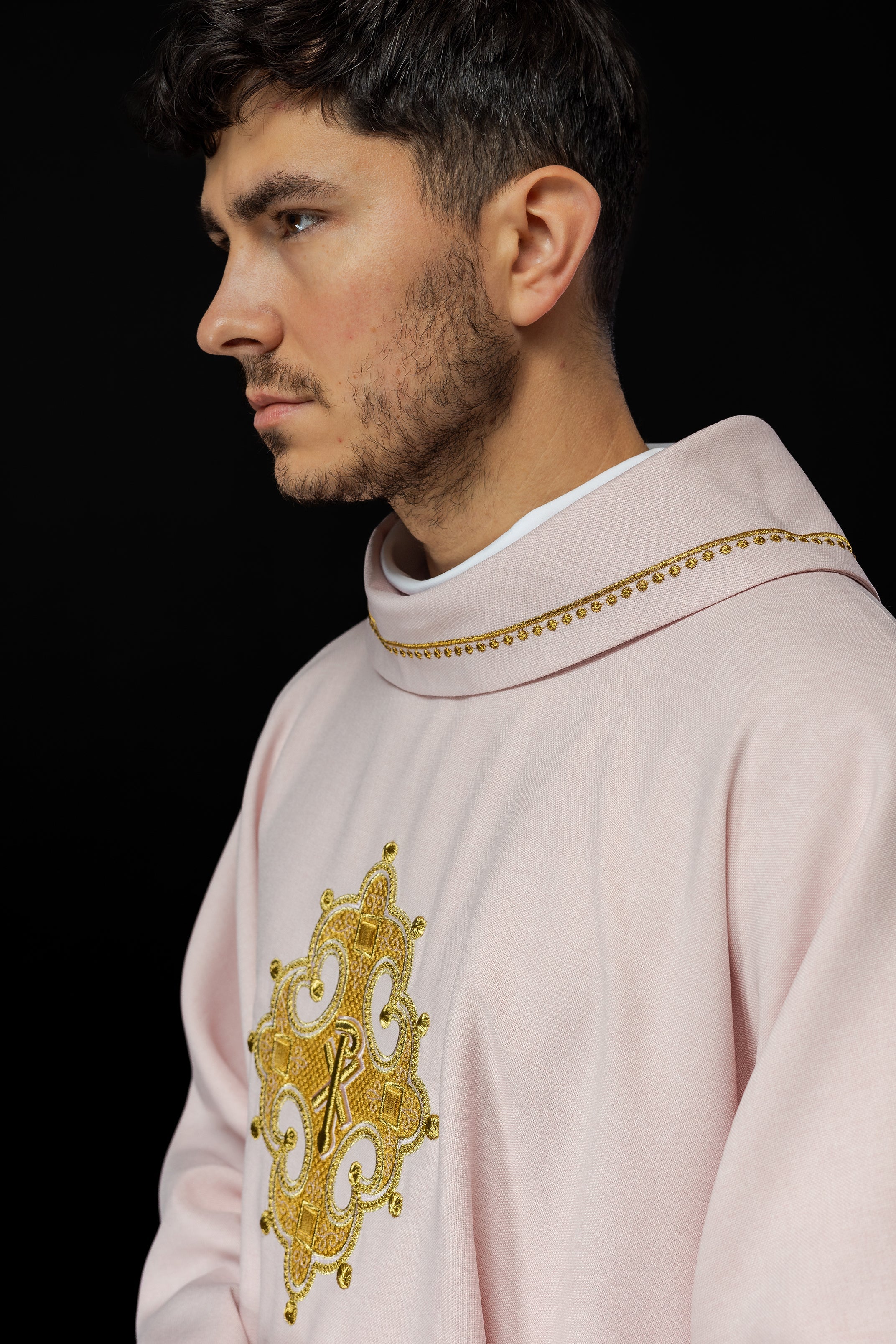 Simple pink chasuble with small PAX motif embroidery