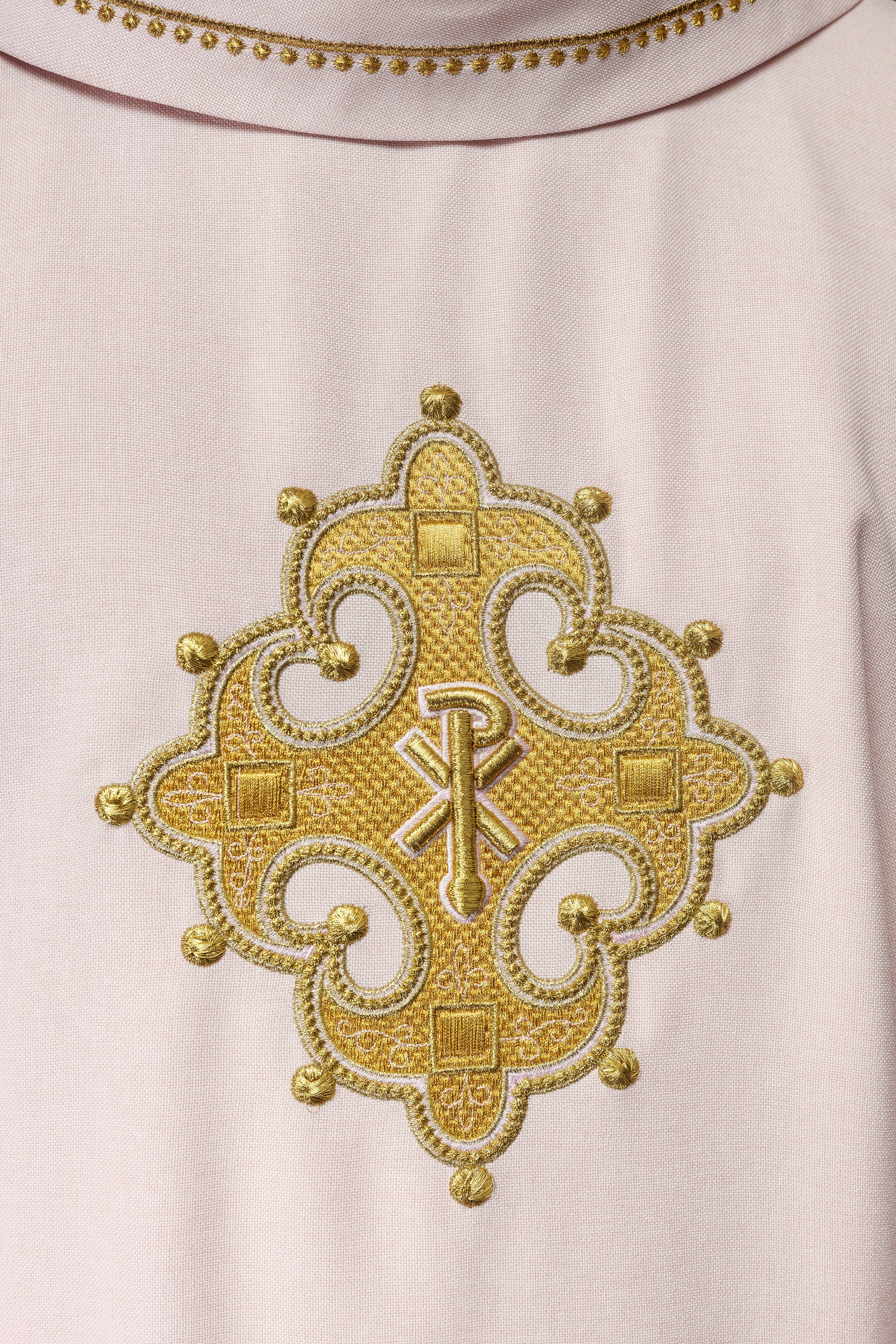 Simple pink chasuble with small PAX motif embroidery