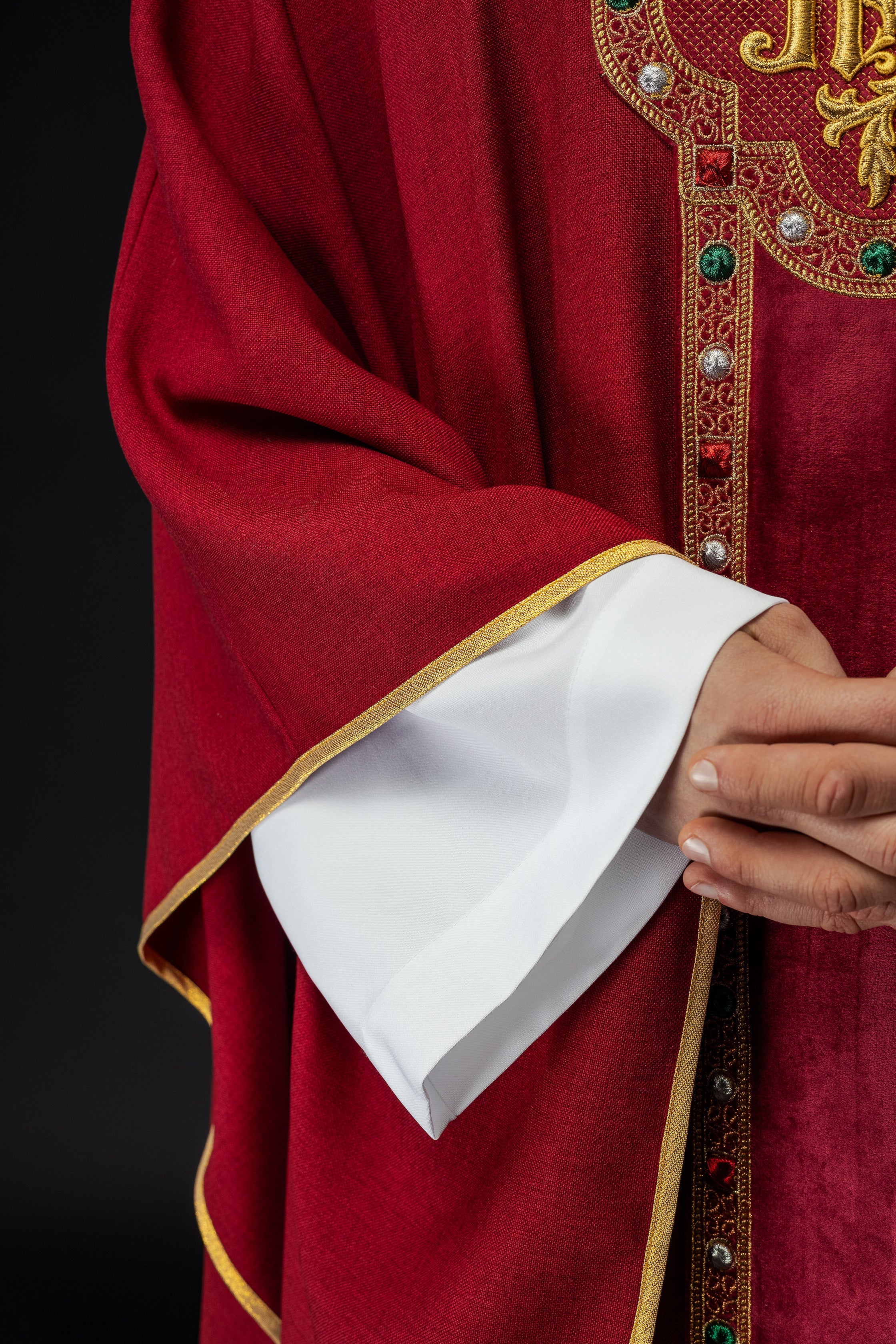 Chasuble with richly embroidered belt and piping around IHS collar embroidery in red