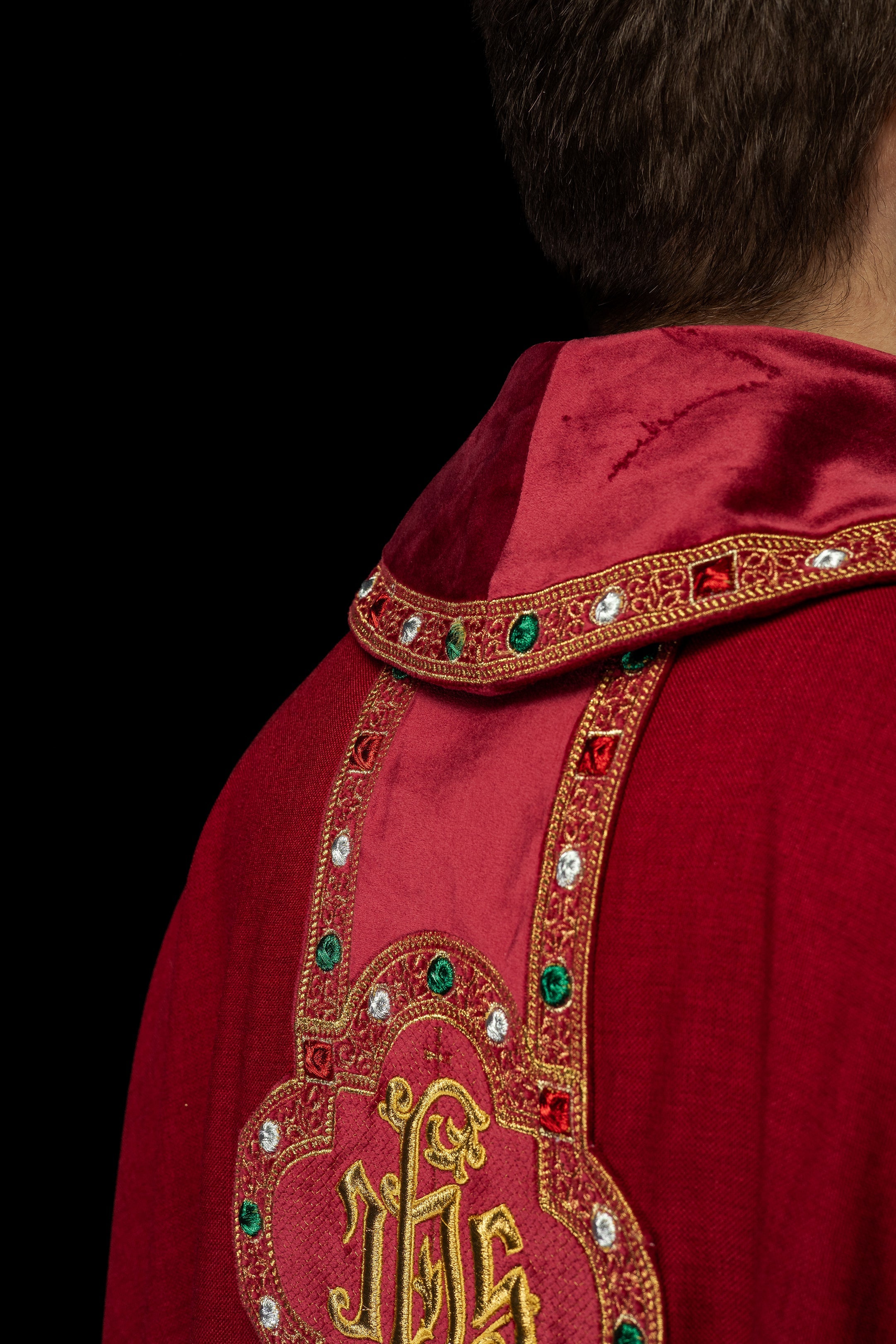 Chasuble with richly embroidered belt and piping around IHS collar embroidery in red