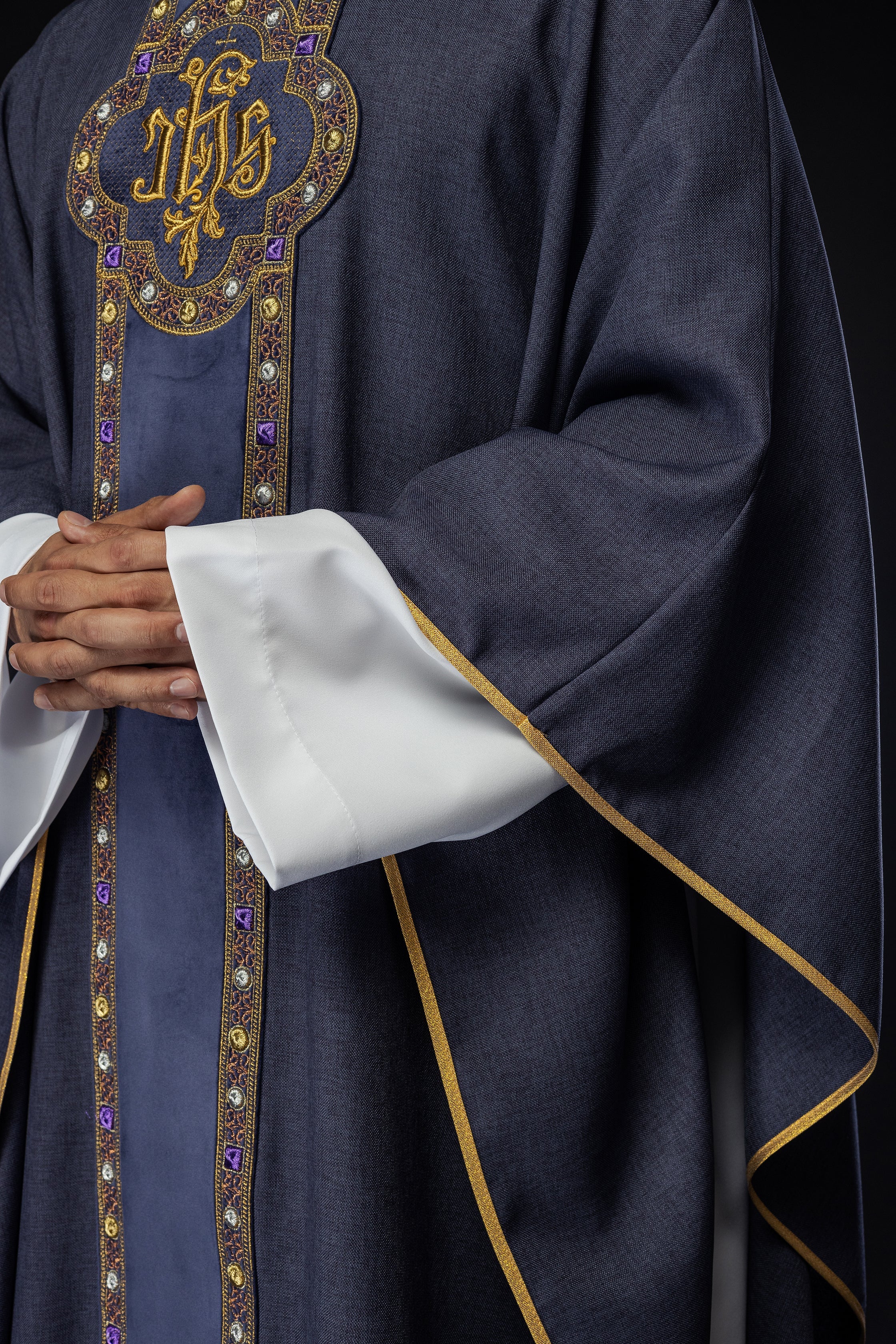 Chasuble with richly embroidered orphrey and piping around the IHS I collar embroidery in purple