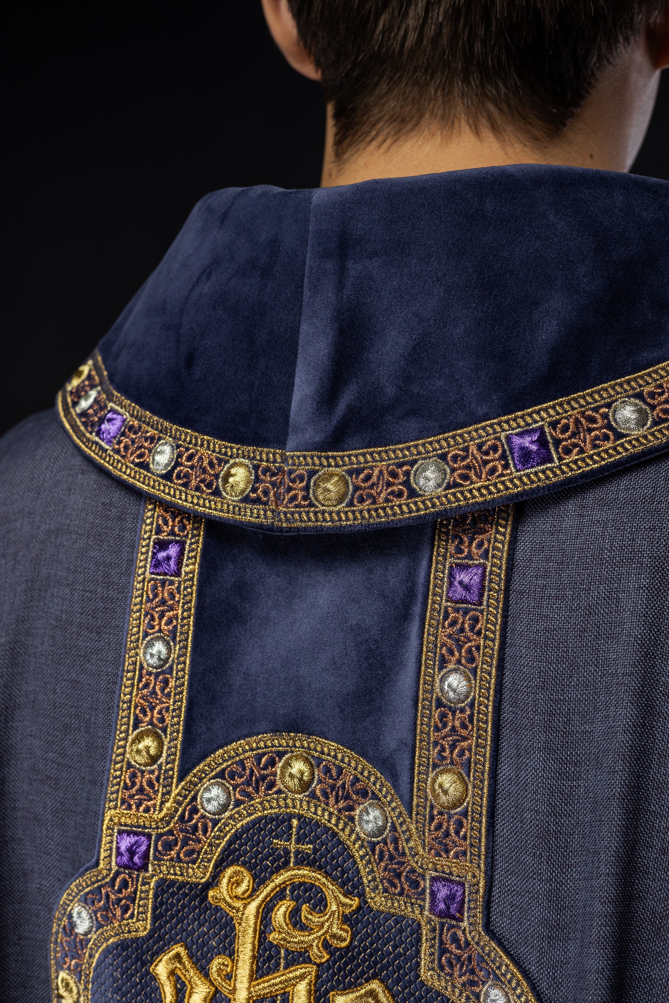 Chasuble with richly embroidered orphrey and piping around the IHS I collar embroidery in purple