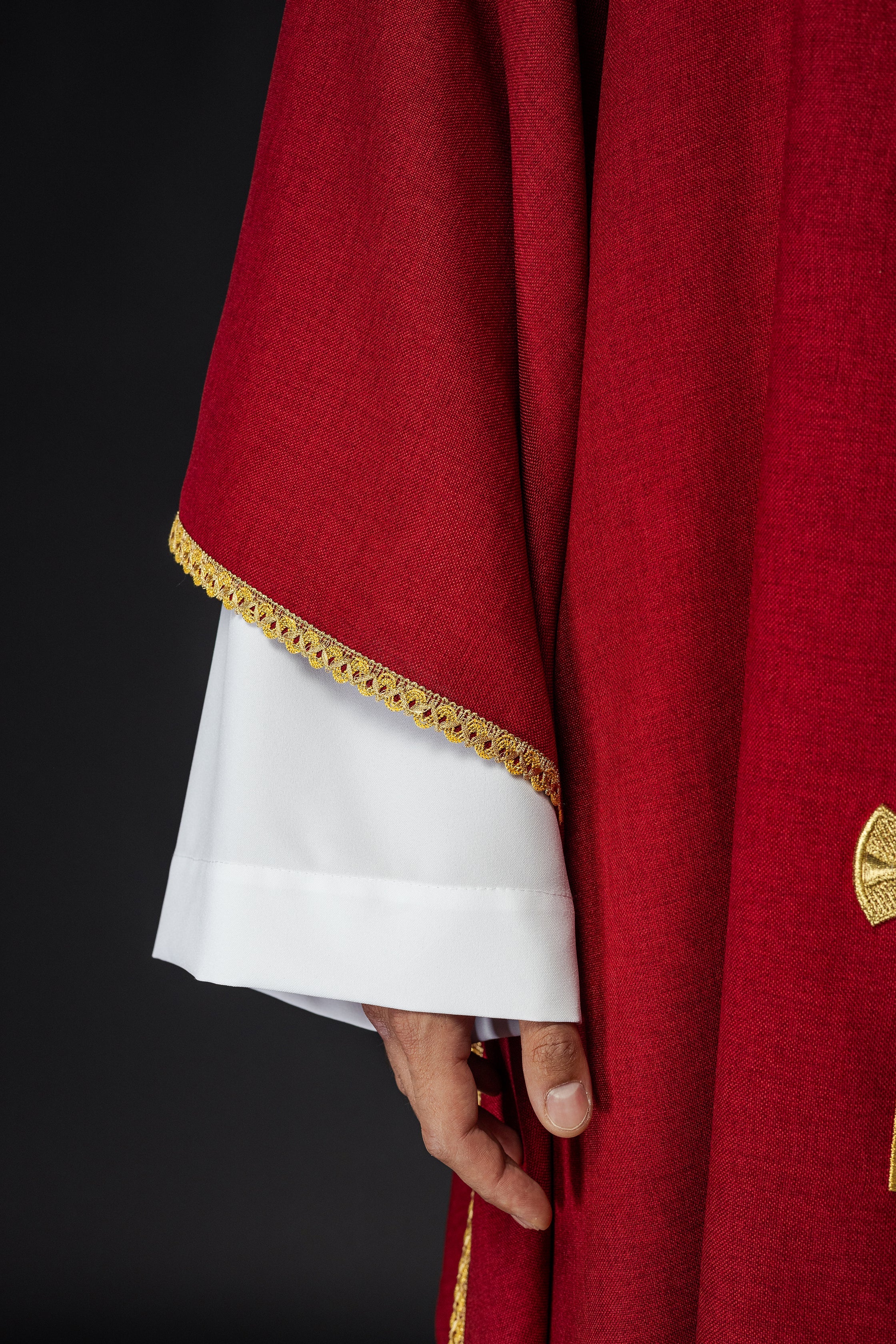 Chasuble with embroidered gold crosses and piping on the collar in red