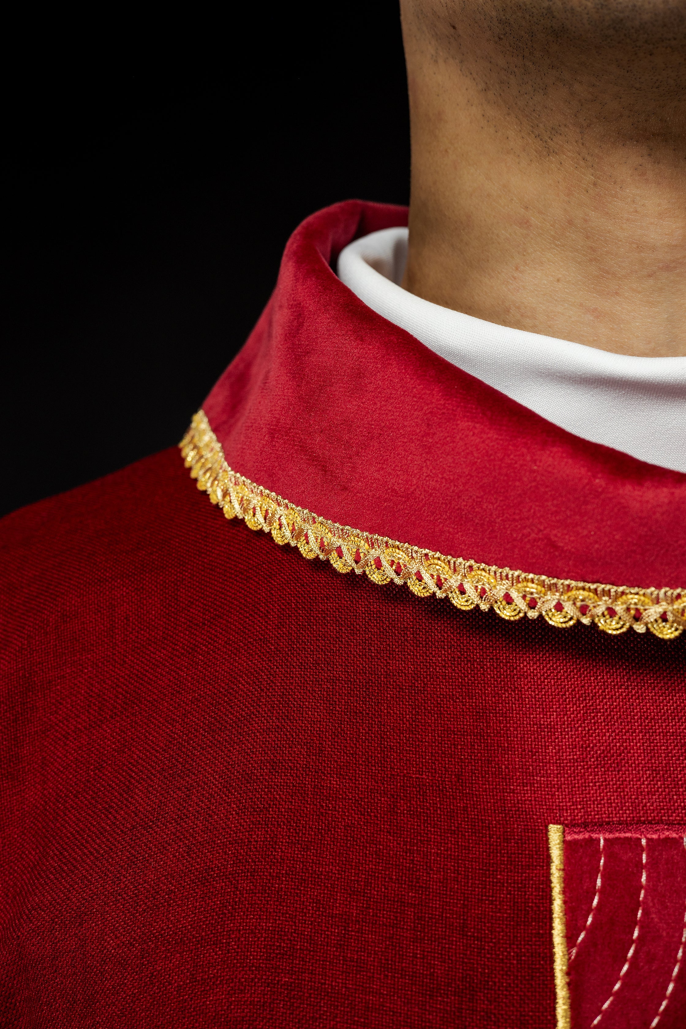 Chasuble with embroidered gold crosses and piping on the collar in red