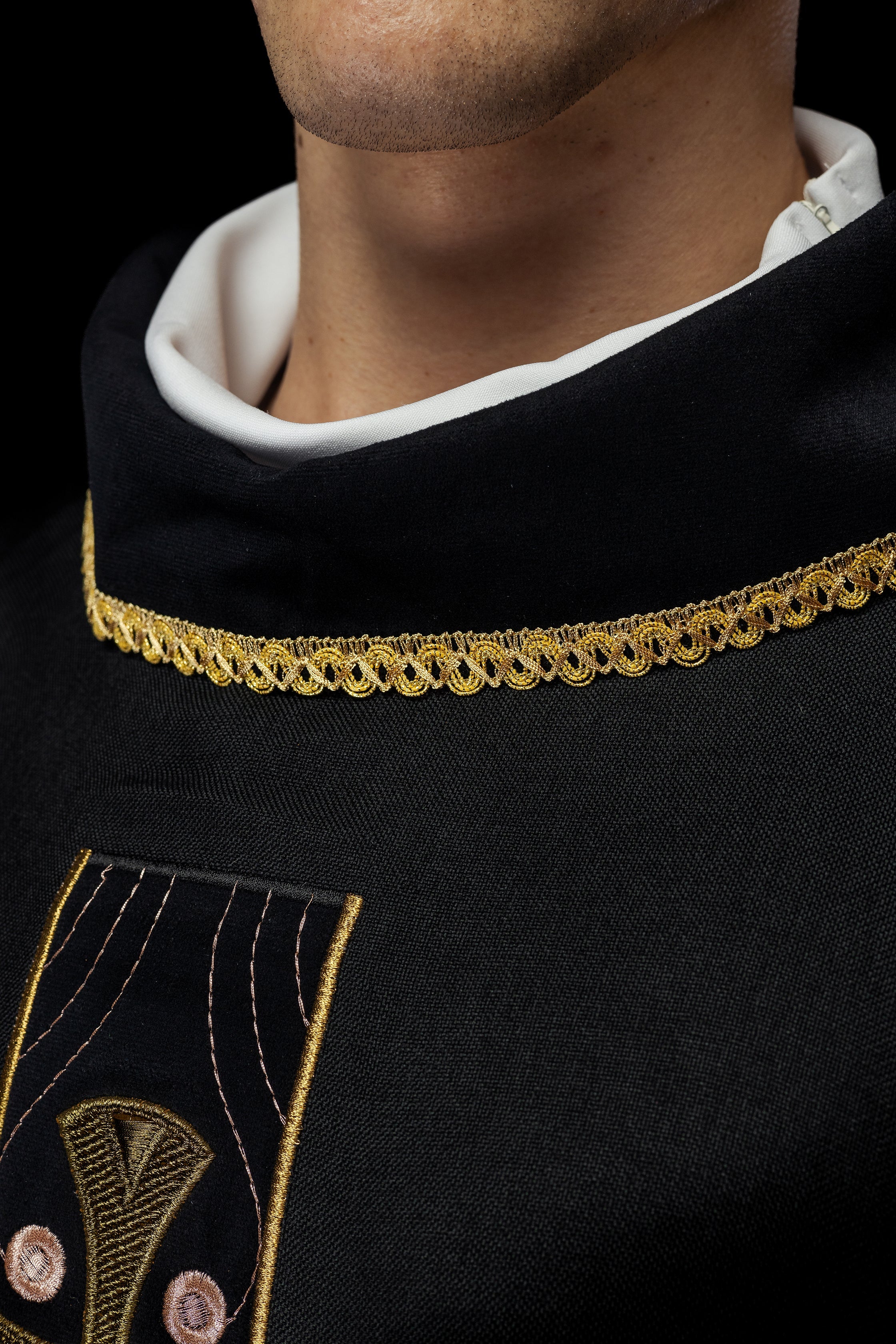 Chasuble with embroidered gold crosses and piping on the collar in black