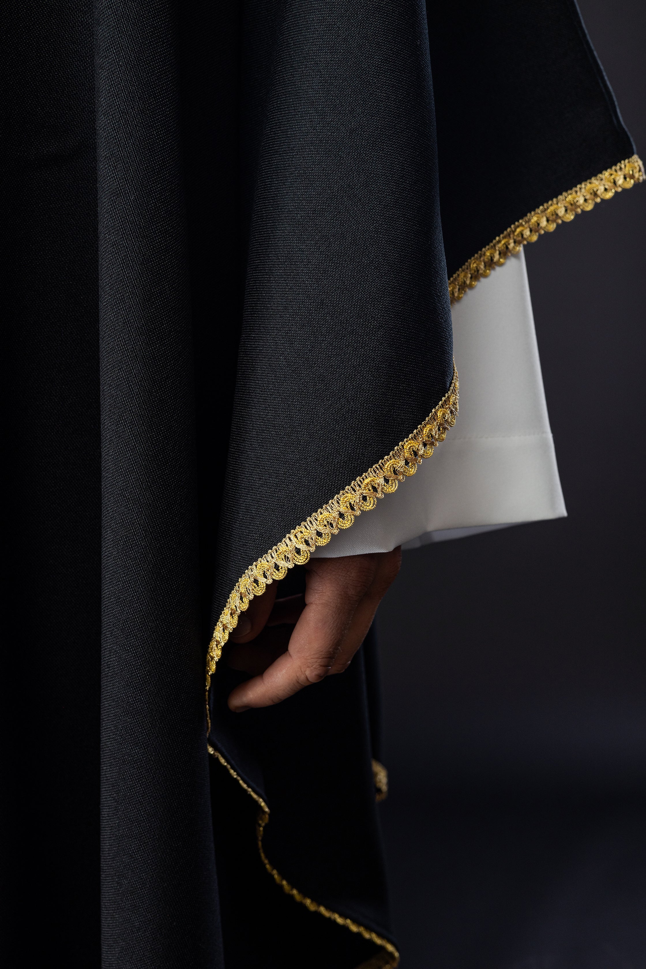 Chasuble with embroidered gold crosses and piping on the collar in black