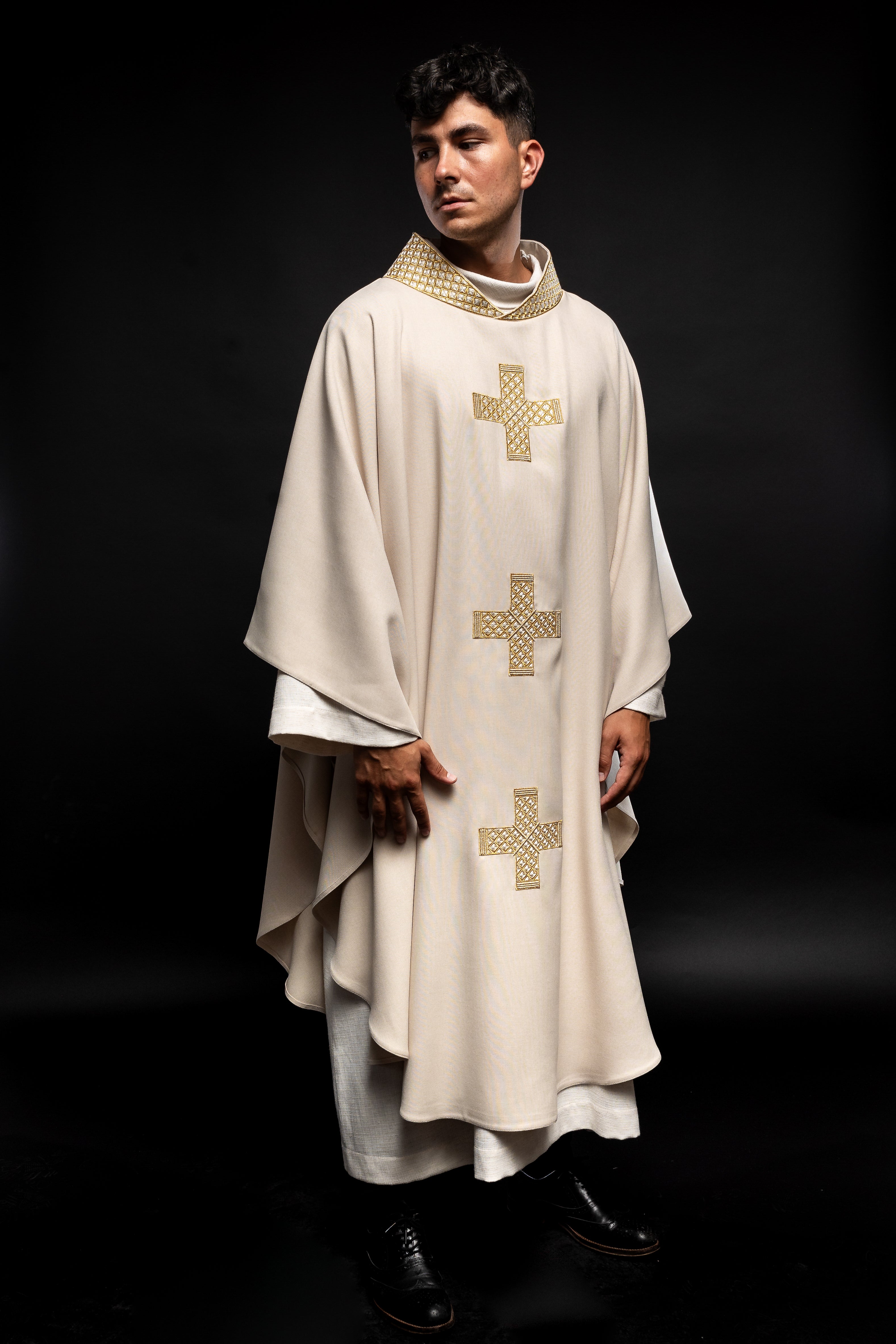 Ecru vestment with decorative collar and gold crosses