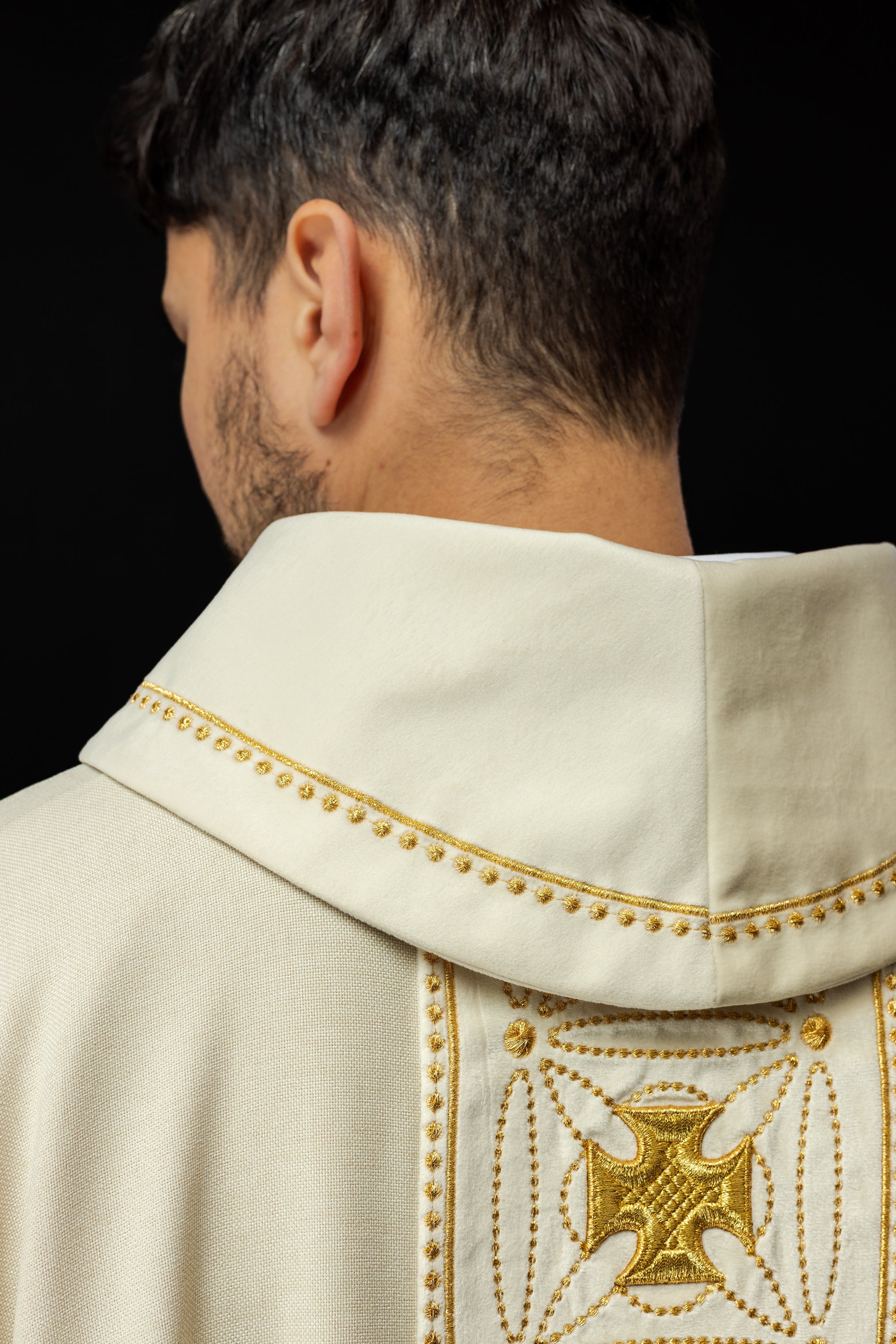 Ivory priest chasuble made of natural texture with embroidered collar