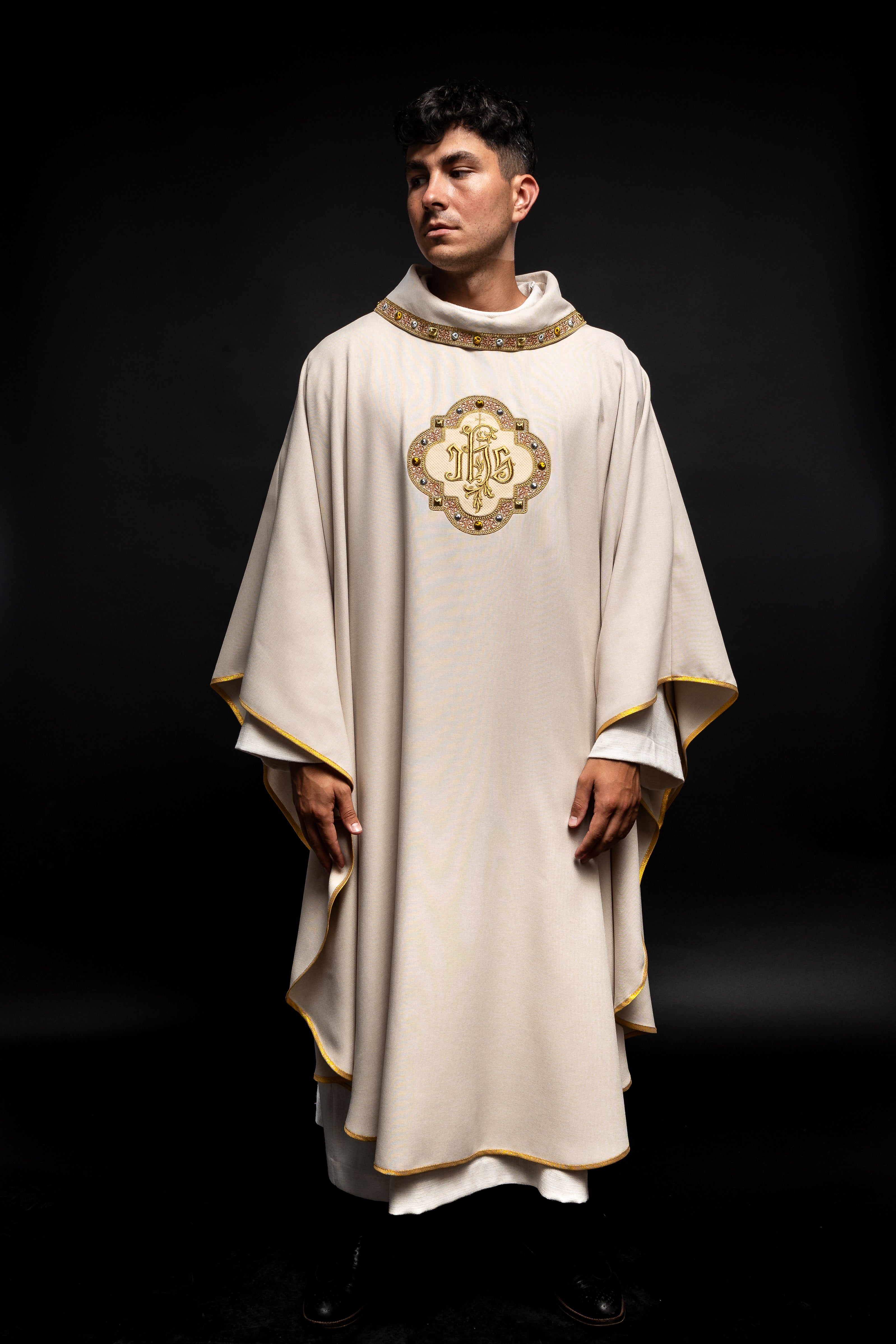 Cream colored chasuble with classic JHS symbol and colorful collar