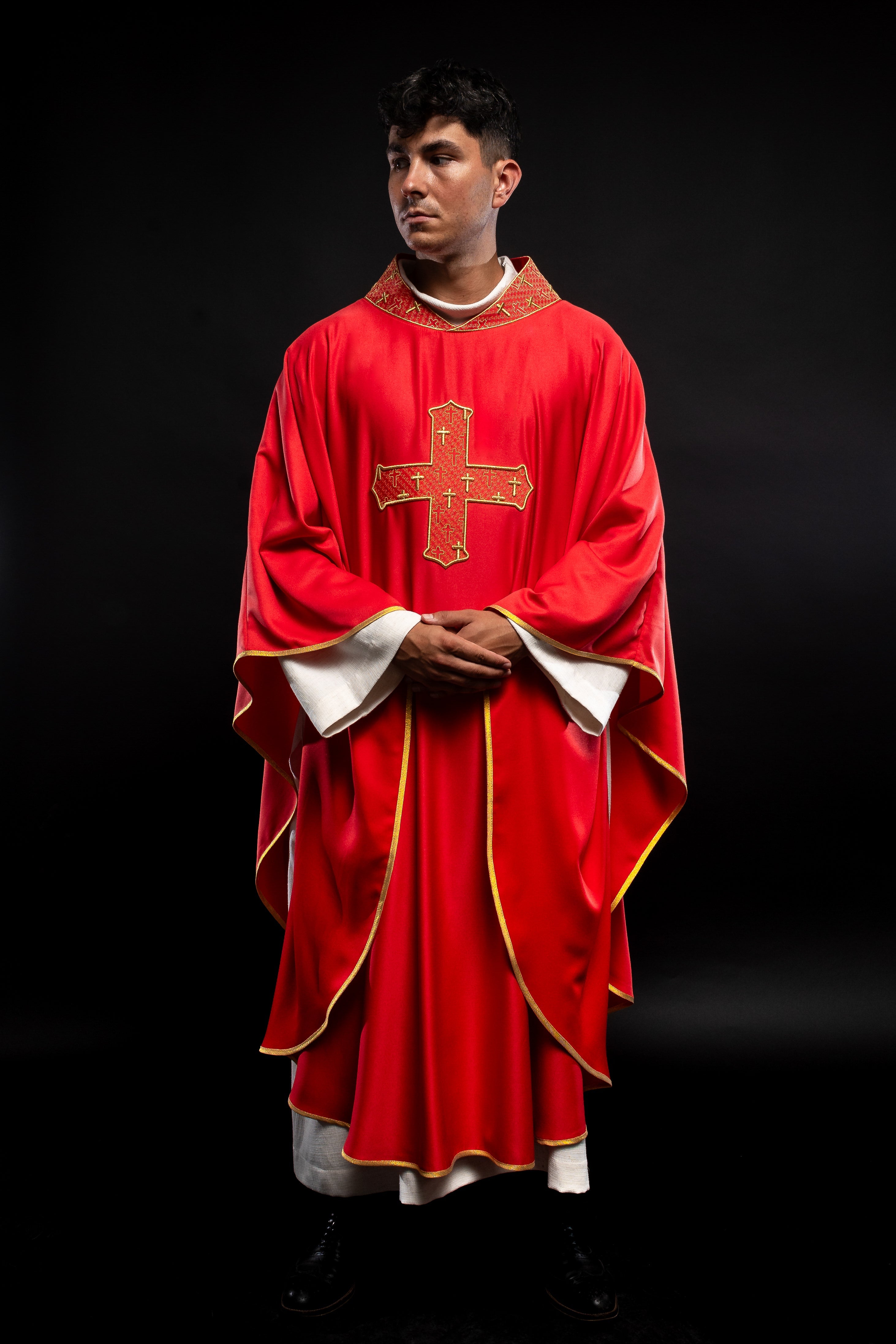 Red priest vestment with collar embroidered with gold crossess