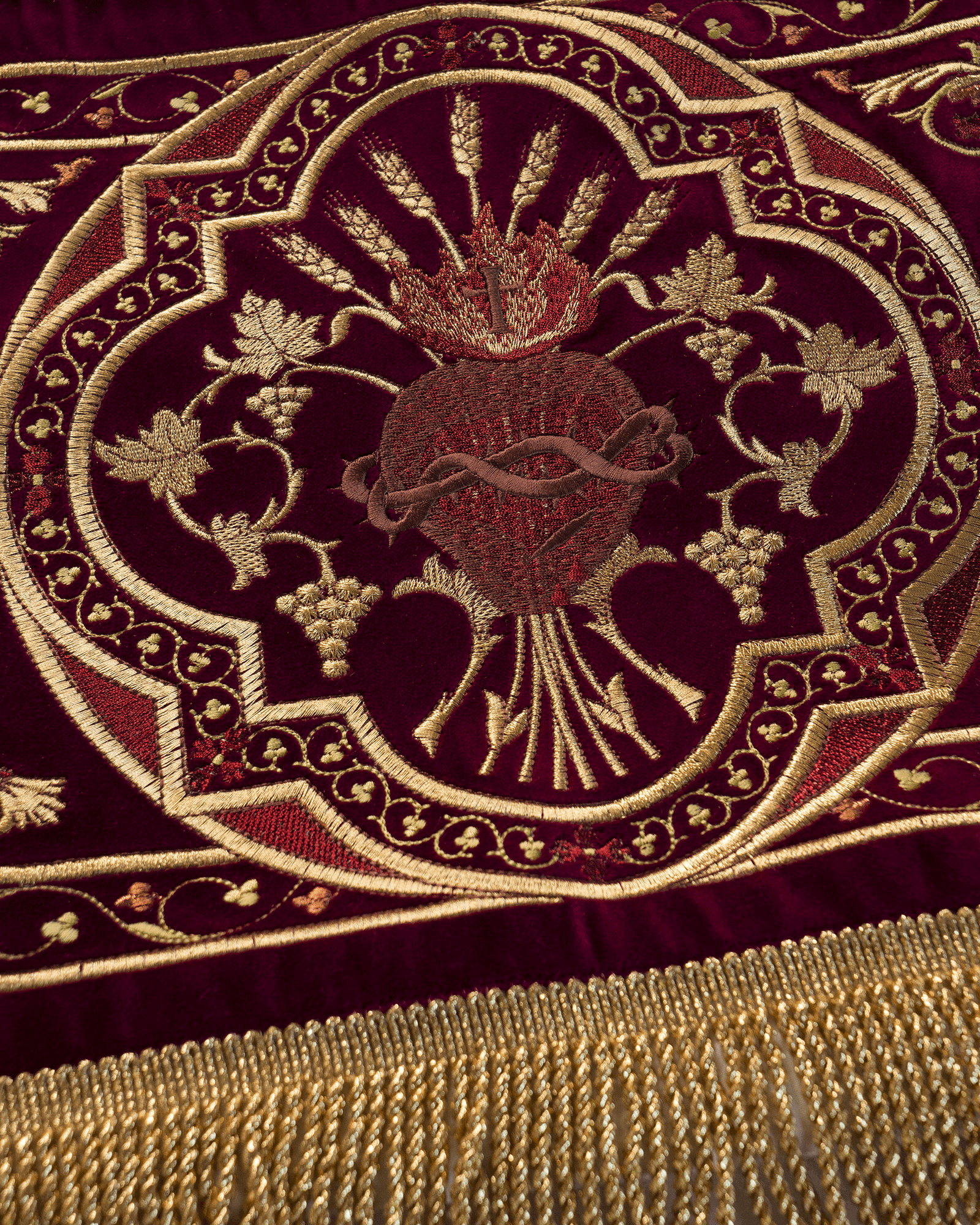 Processional canopy for Corpus Christi made of maroon velvet