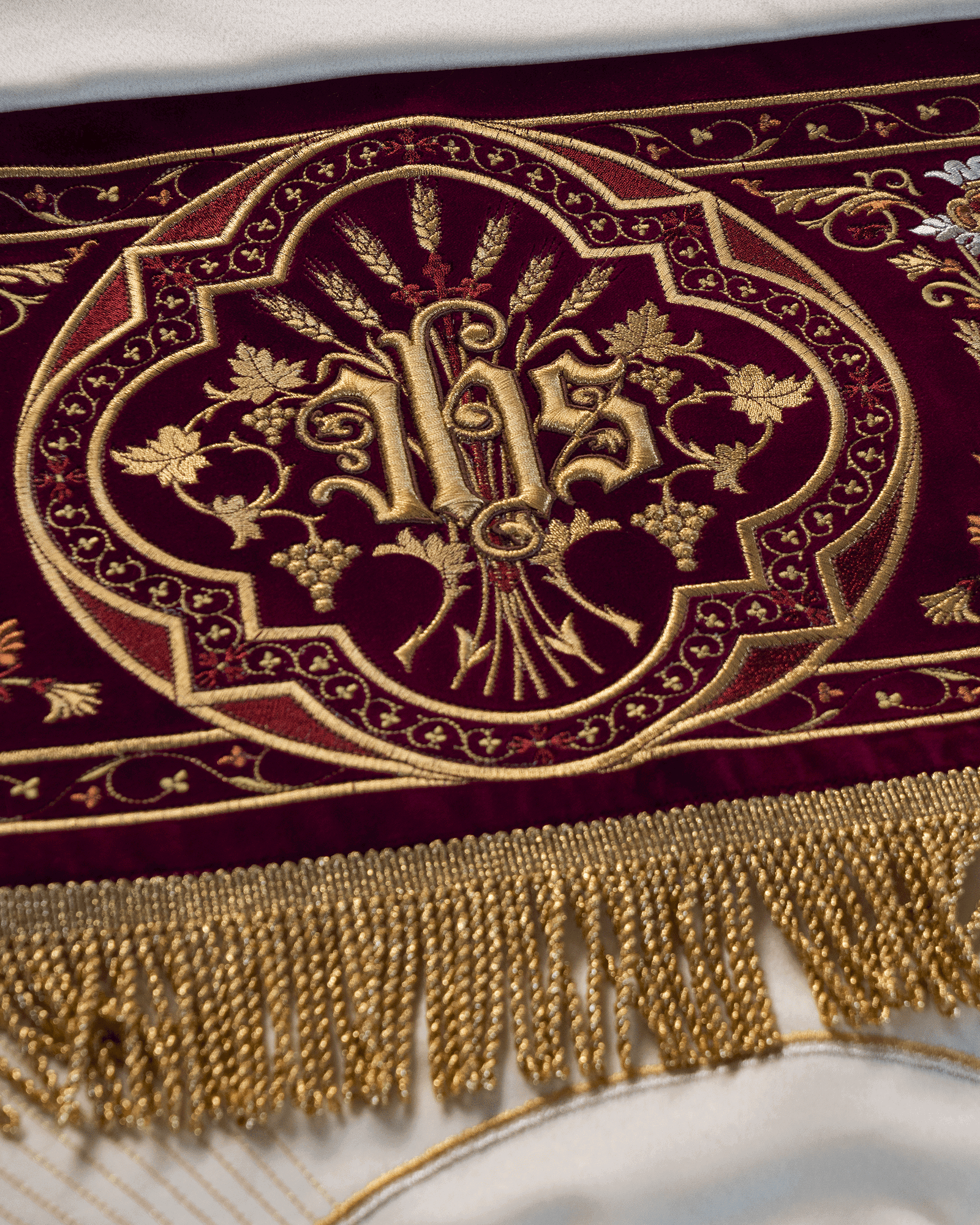 Processional canopy for Corpus Christi made of maroon velvet