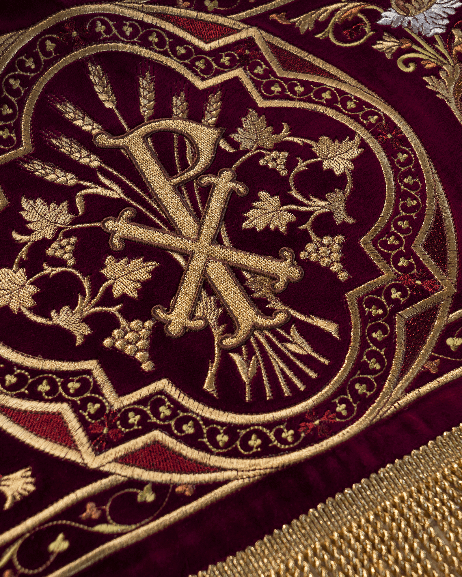 Processional canopy for Corpus Christi made of maroon velvet