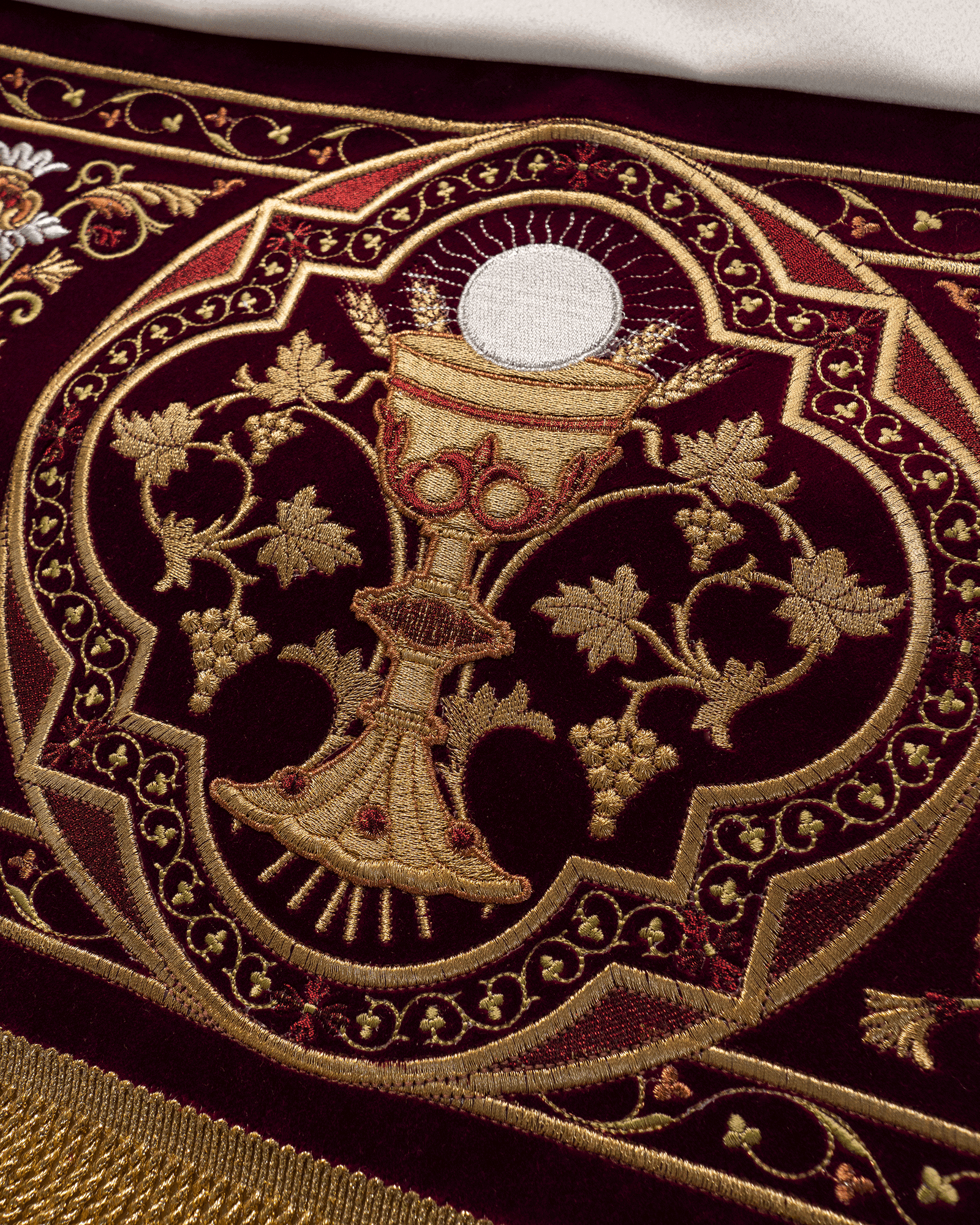 Processional canopy for Corpus Christi made of maroon velvet