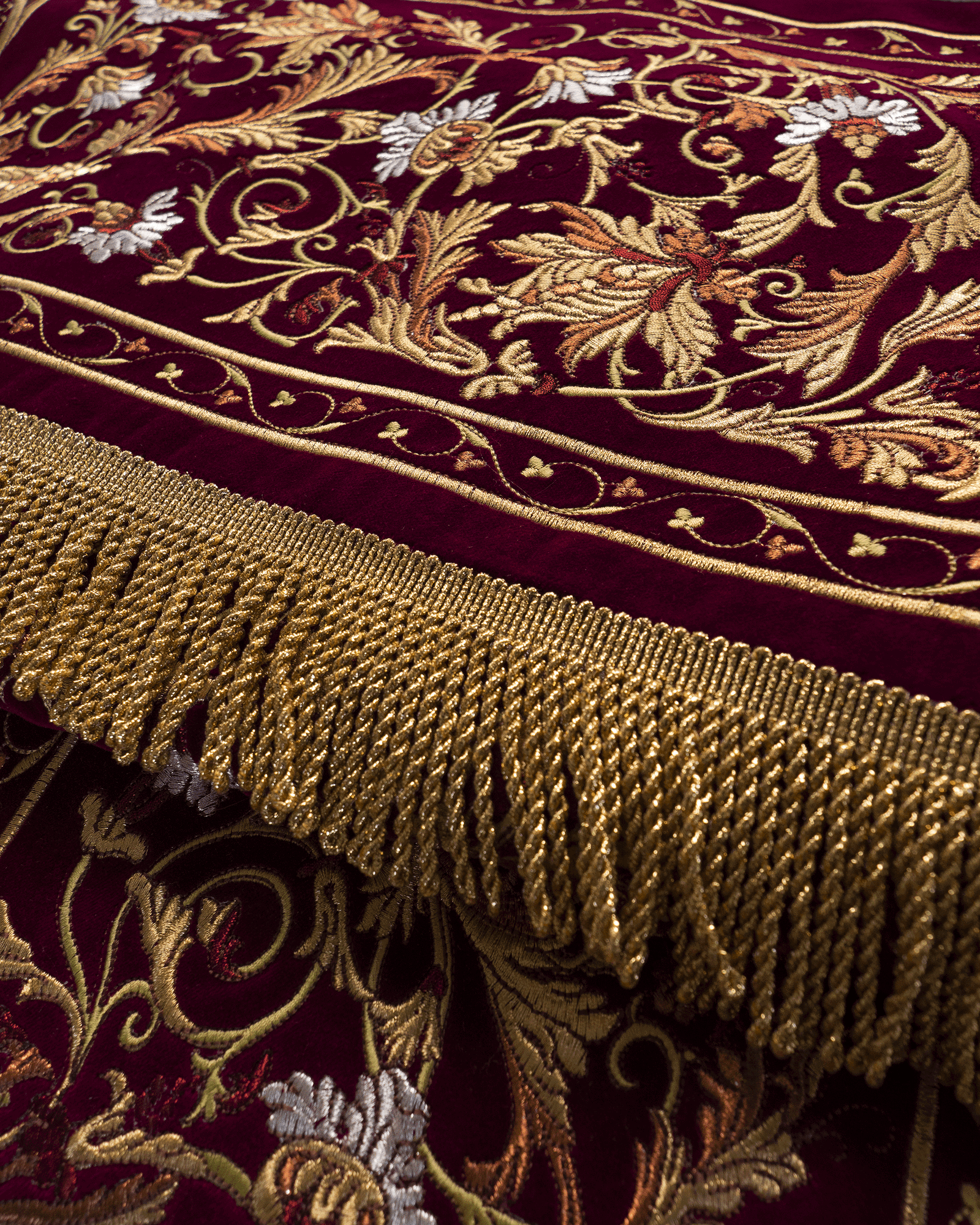 Processional canopy for Corpus Christi made of maroon velvet