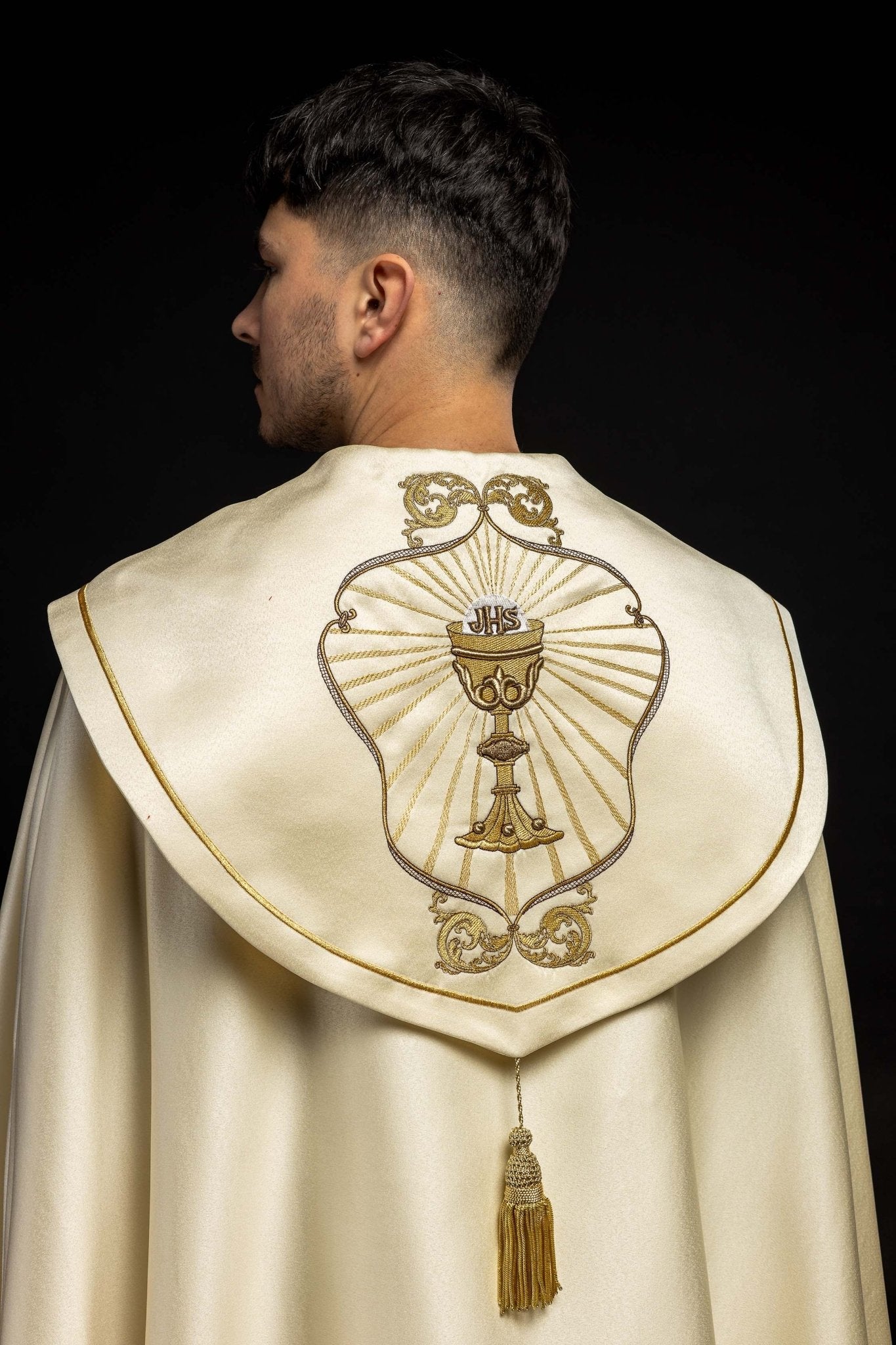 Clerical cope with embroidered gold IHS motif KKP/006/05 ECRU SAT.POMPON 145cm - HAFTINAUSA.COM