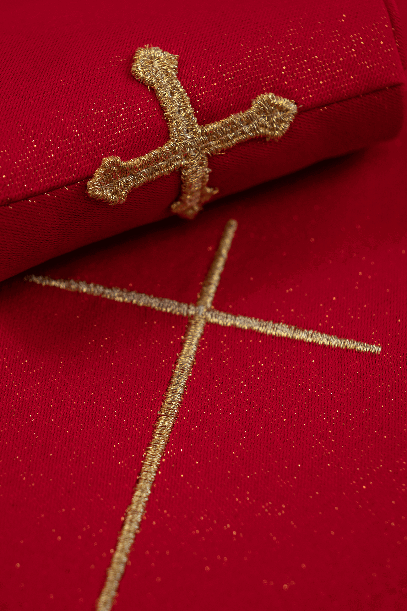 Red chasuble on shiny fabric