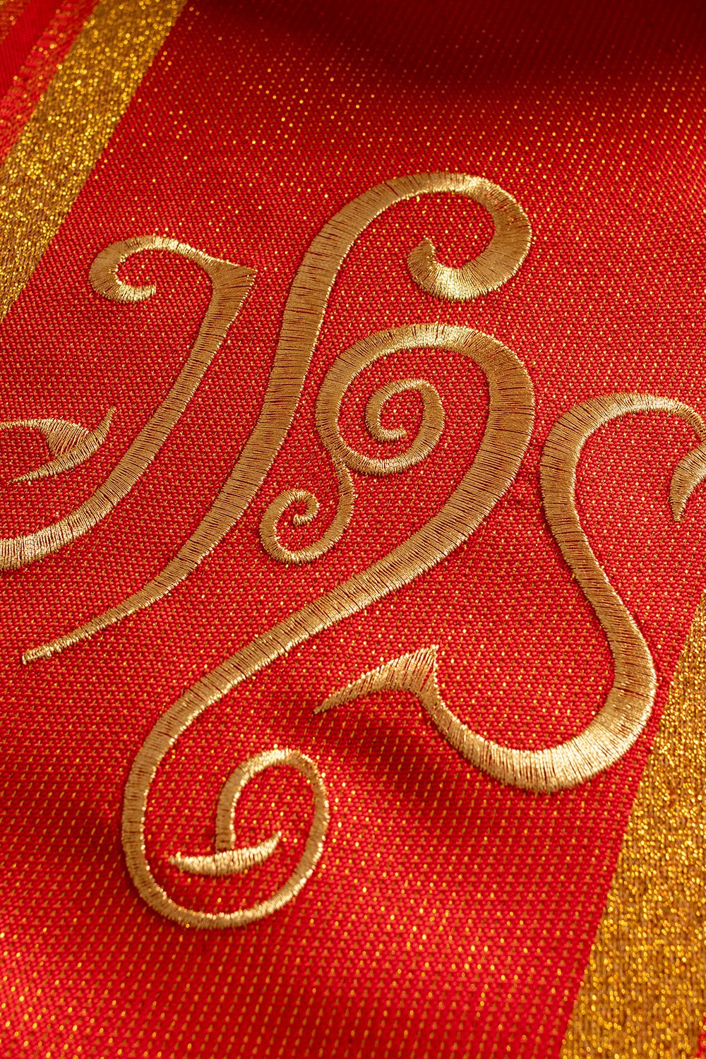 Red chasuble embroidered with IHS motif with gilding