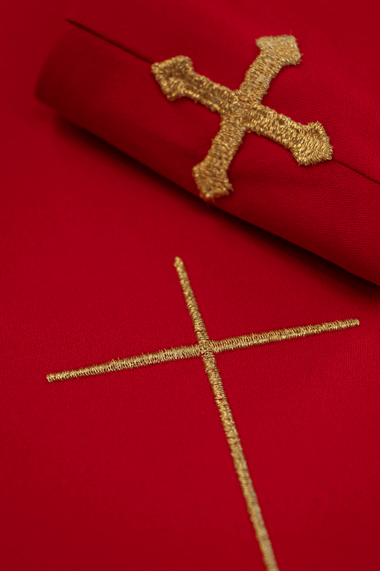 Red liturgical chasuble decorated with an embroidered belt