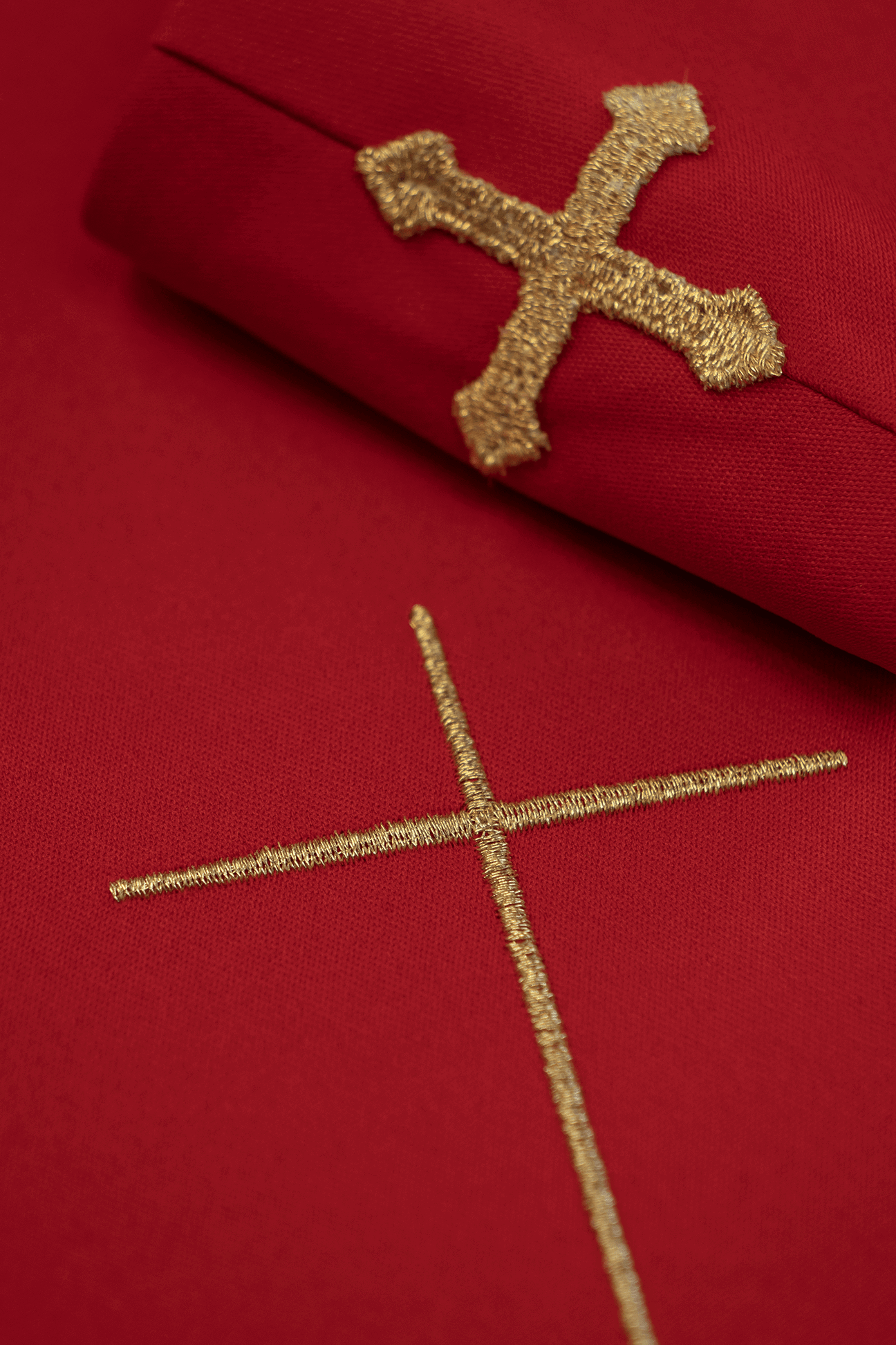 Red liturgical chasuble decorated with a gold embroidered belt