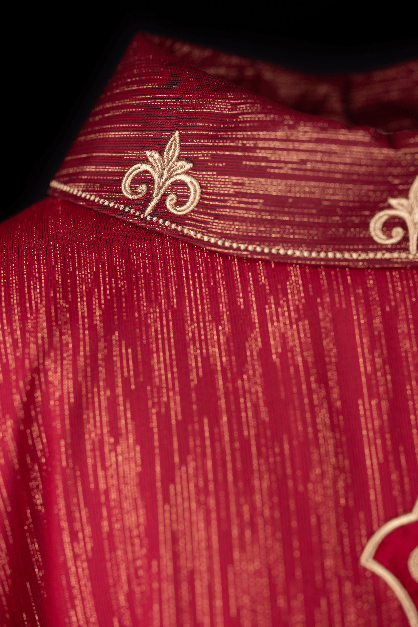 Red chasuble with richly embroidered cross and decorated collar