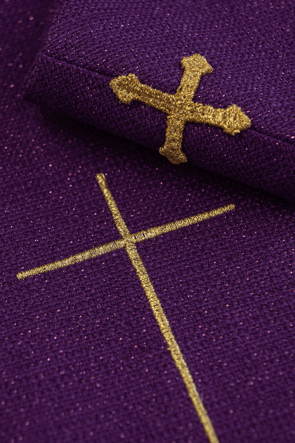 Shiny, richly embroidered purple chasuble