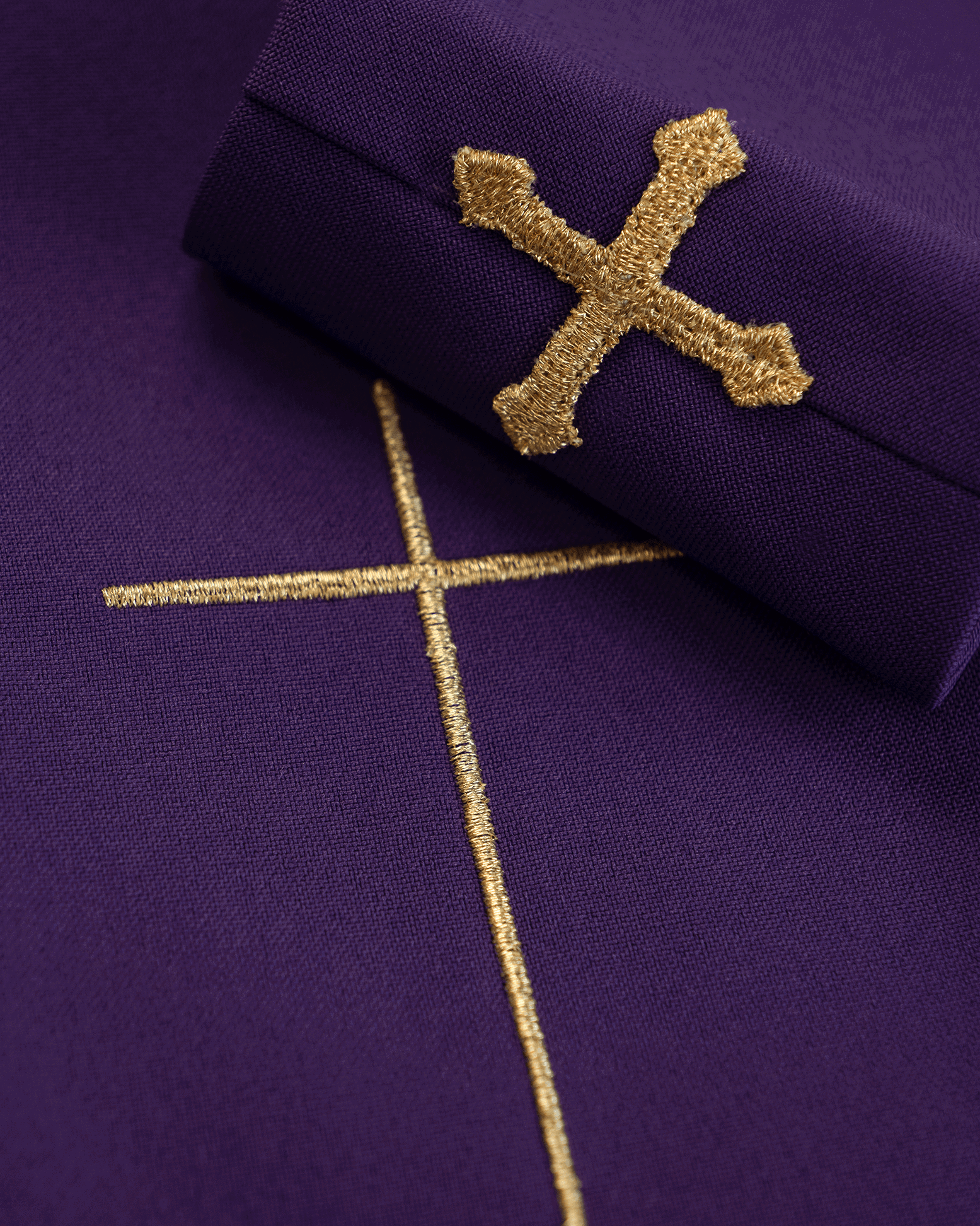 Purple chasuble embroidered on light fabric