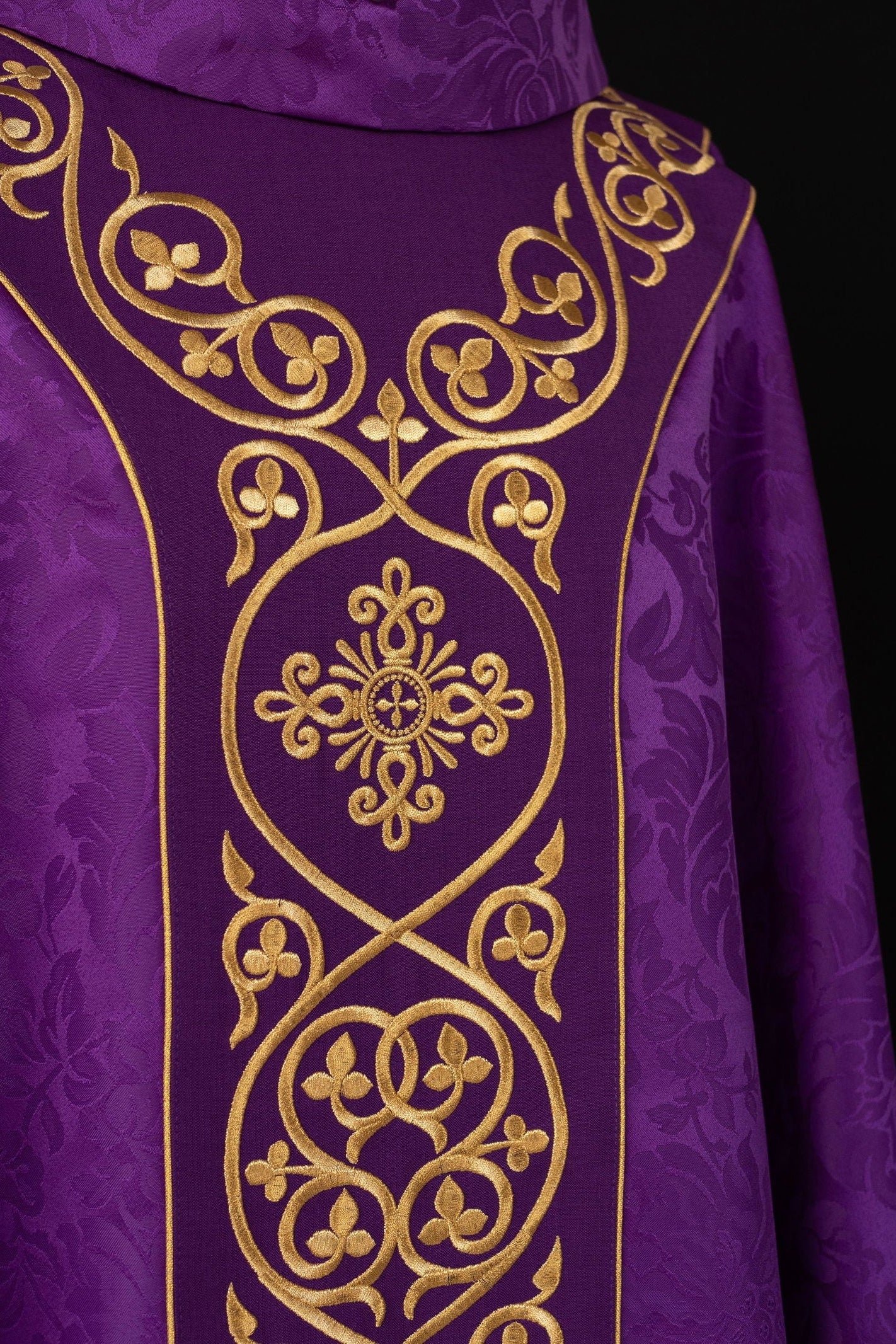 Purple liturgical chasuble decorated with velvet belt with embroidery