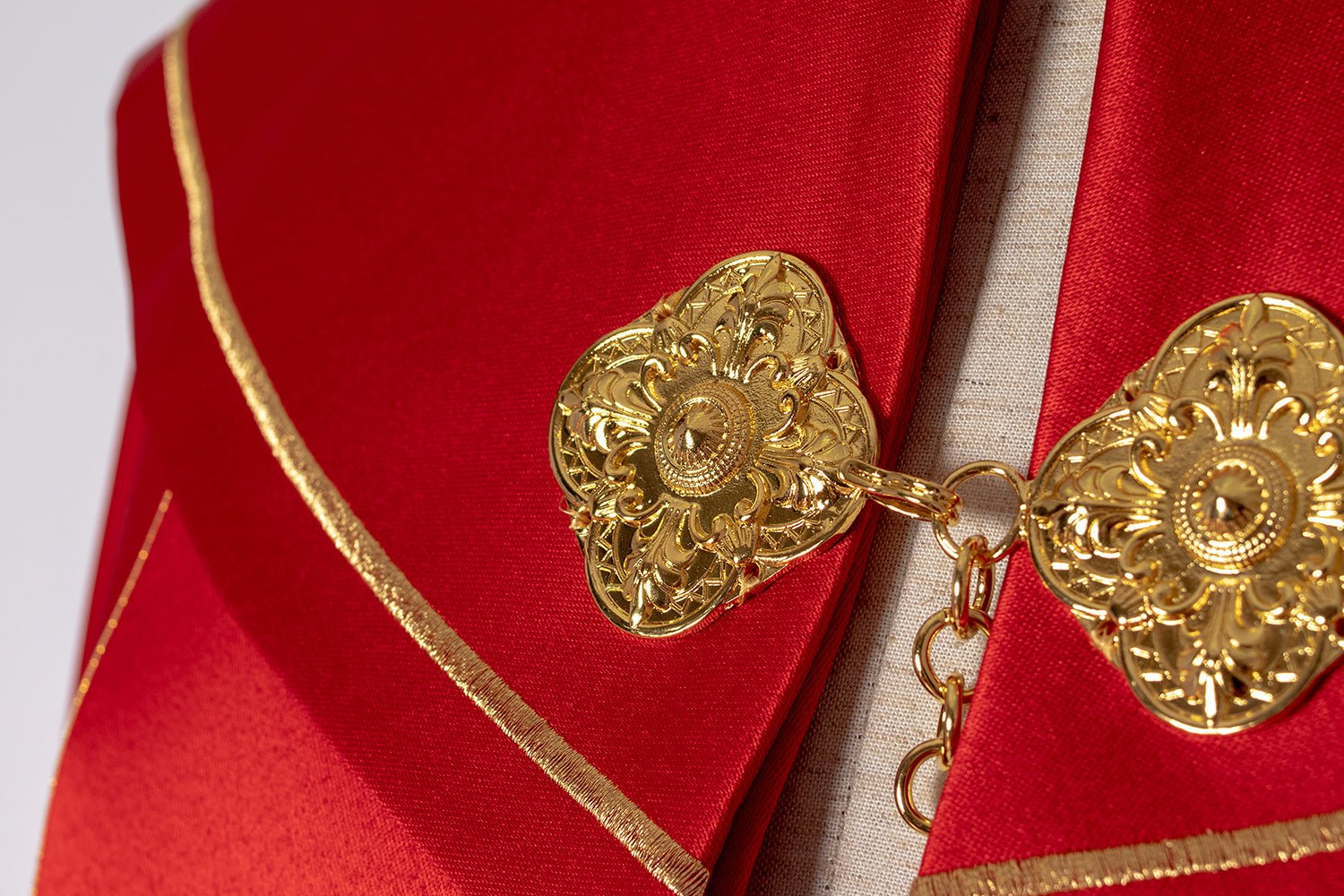 Liturgical cope made from red satin with gold embroidery