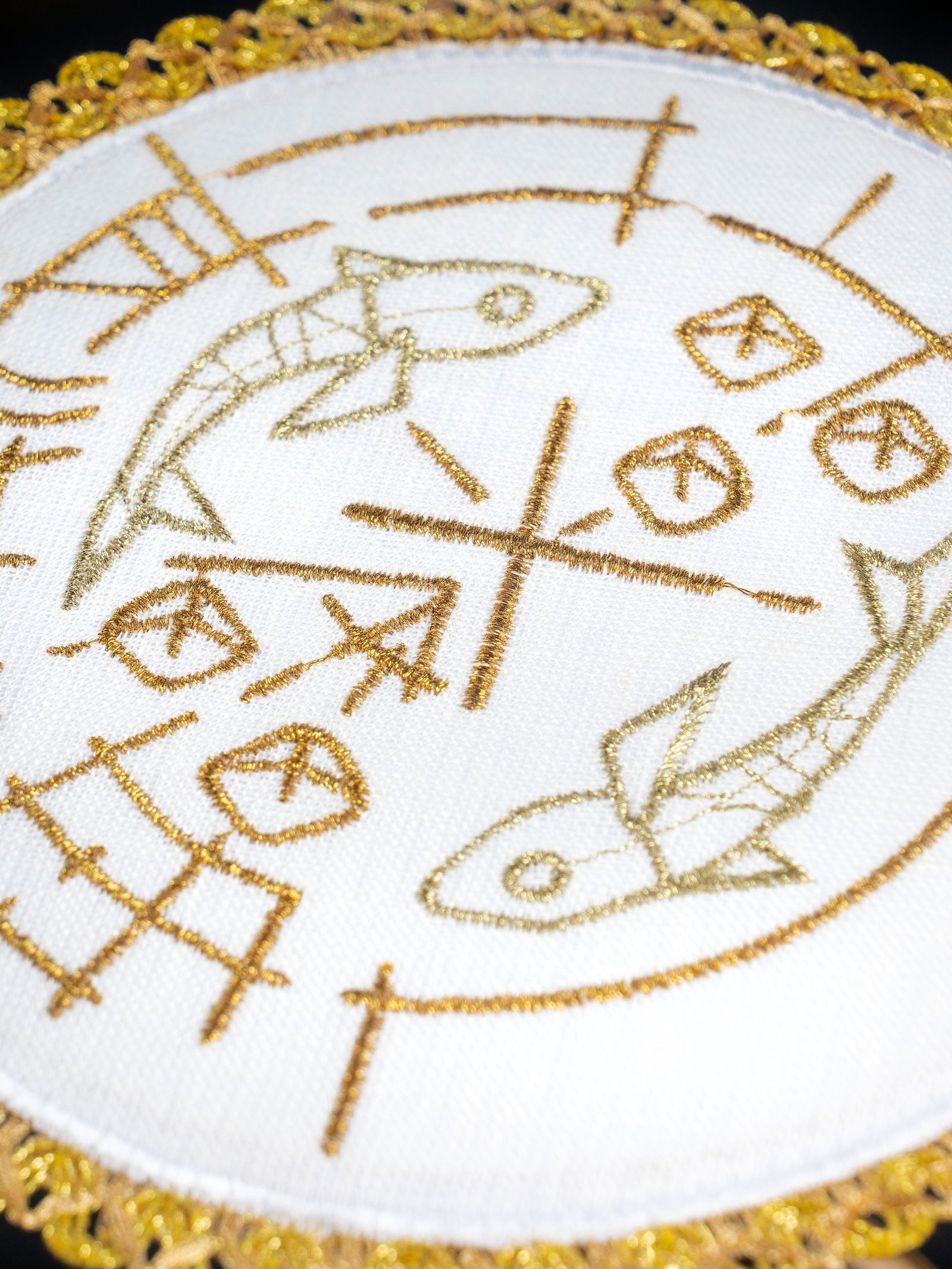 Chalice linens set with motif of fish, bread and cross round pall