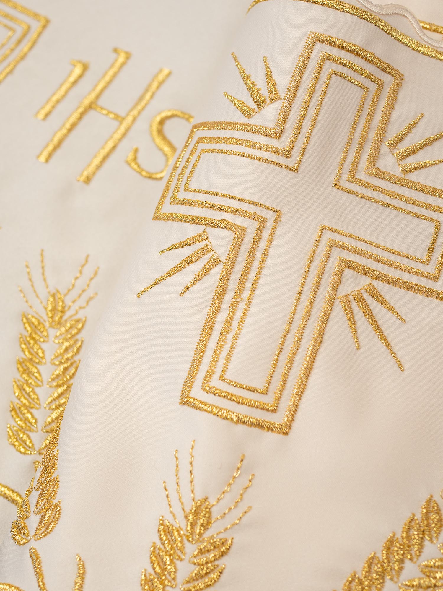 Cream colored liturgical superfrontal with IHS and cross gold embroidery