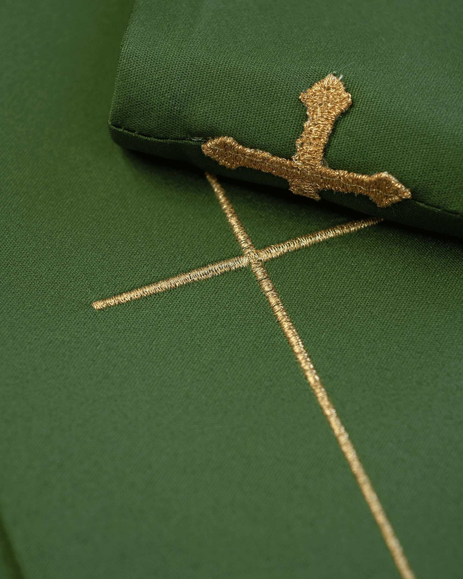 Richly embroidered green chasuble