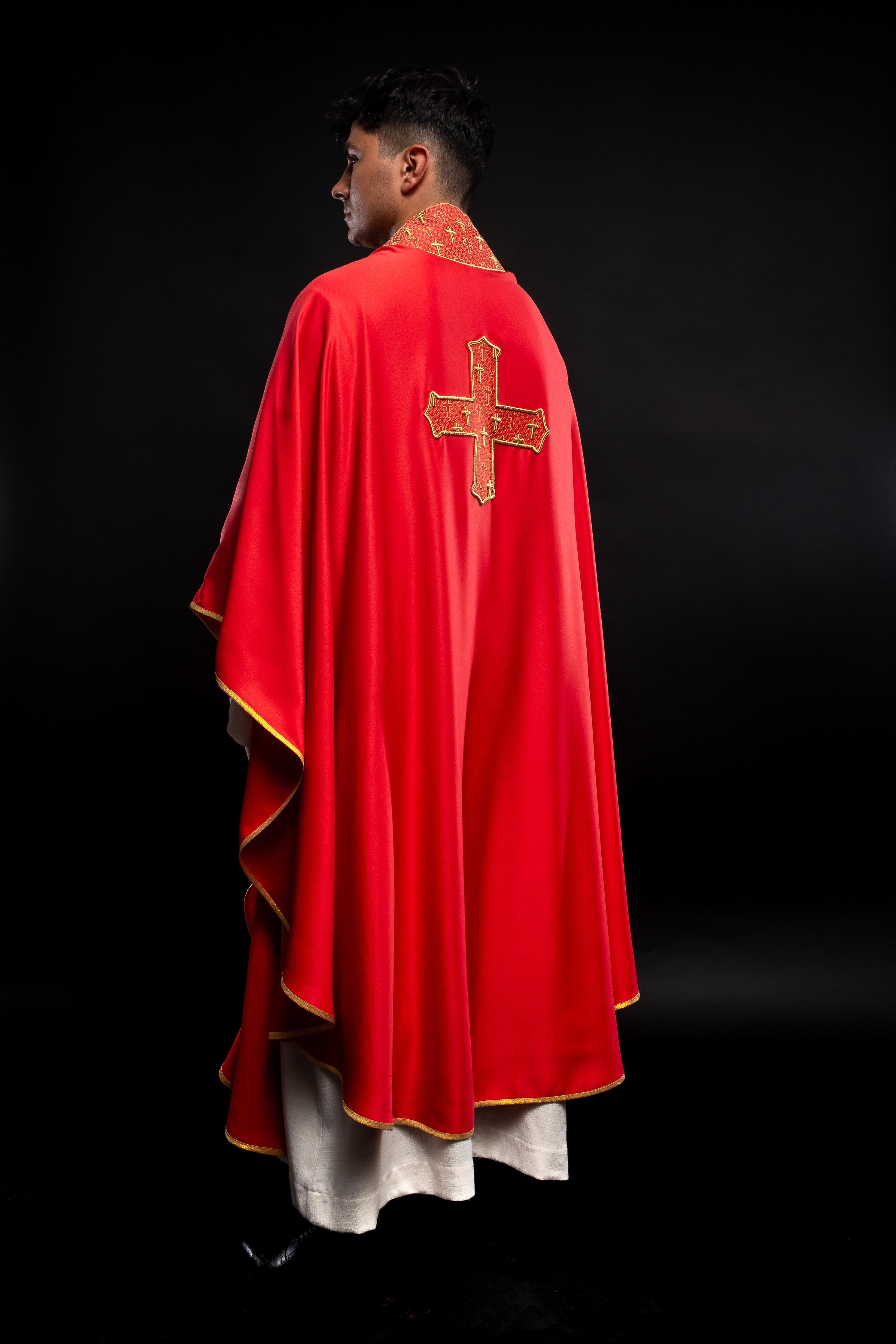 Red priest vestment with collar embroidered with gold crossess