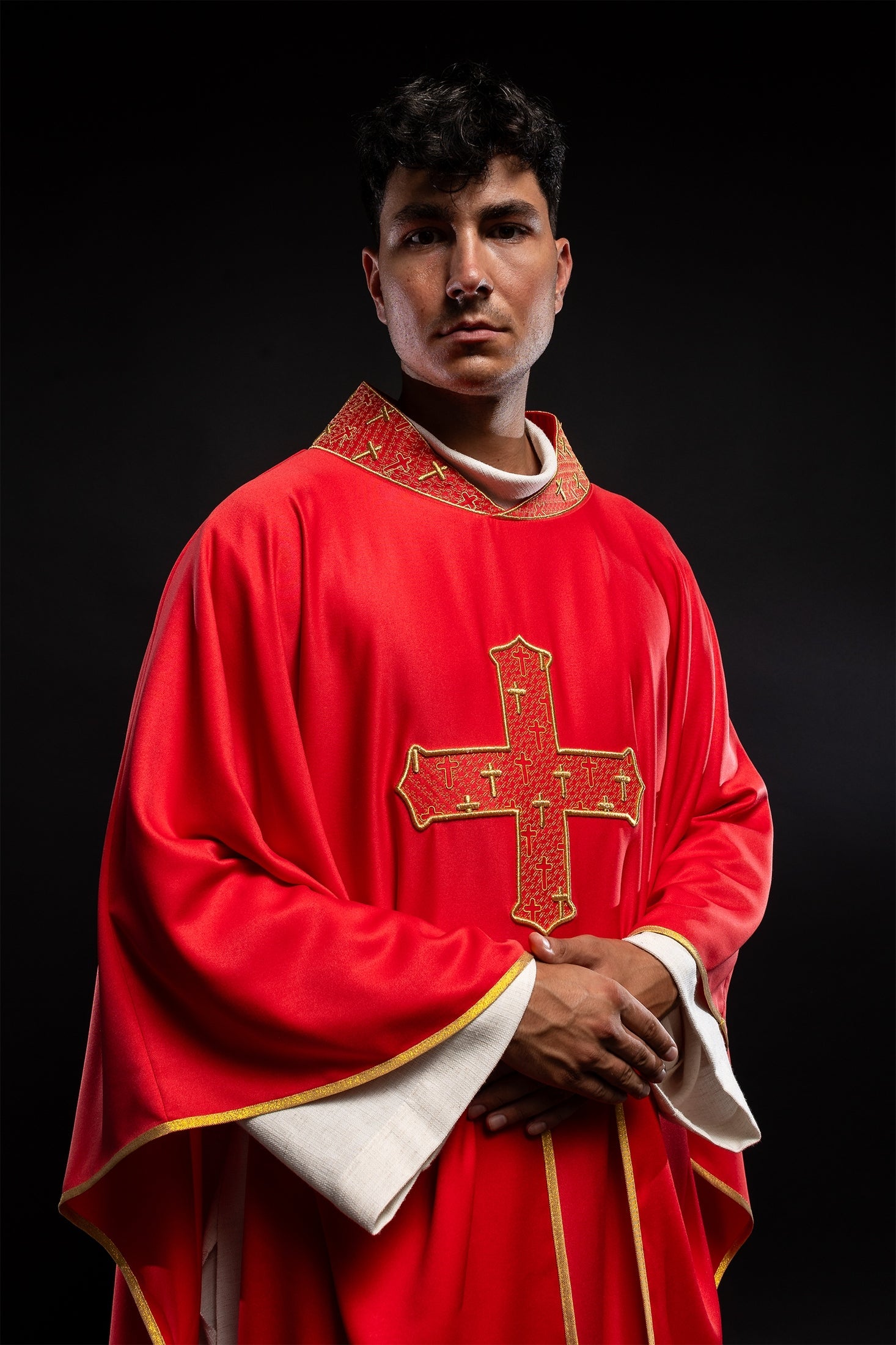 Red priest vestment with collar embroidered with gold crossess