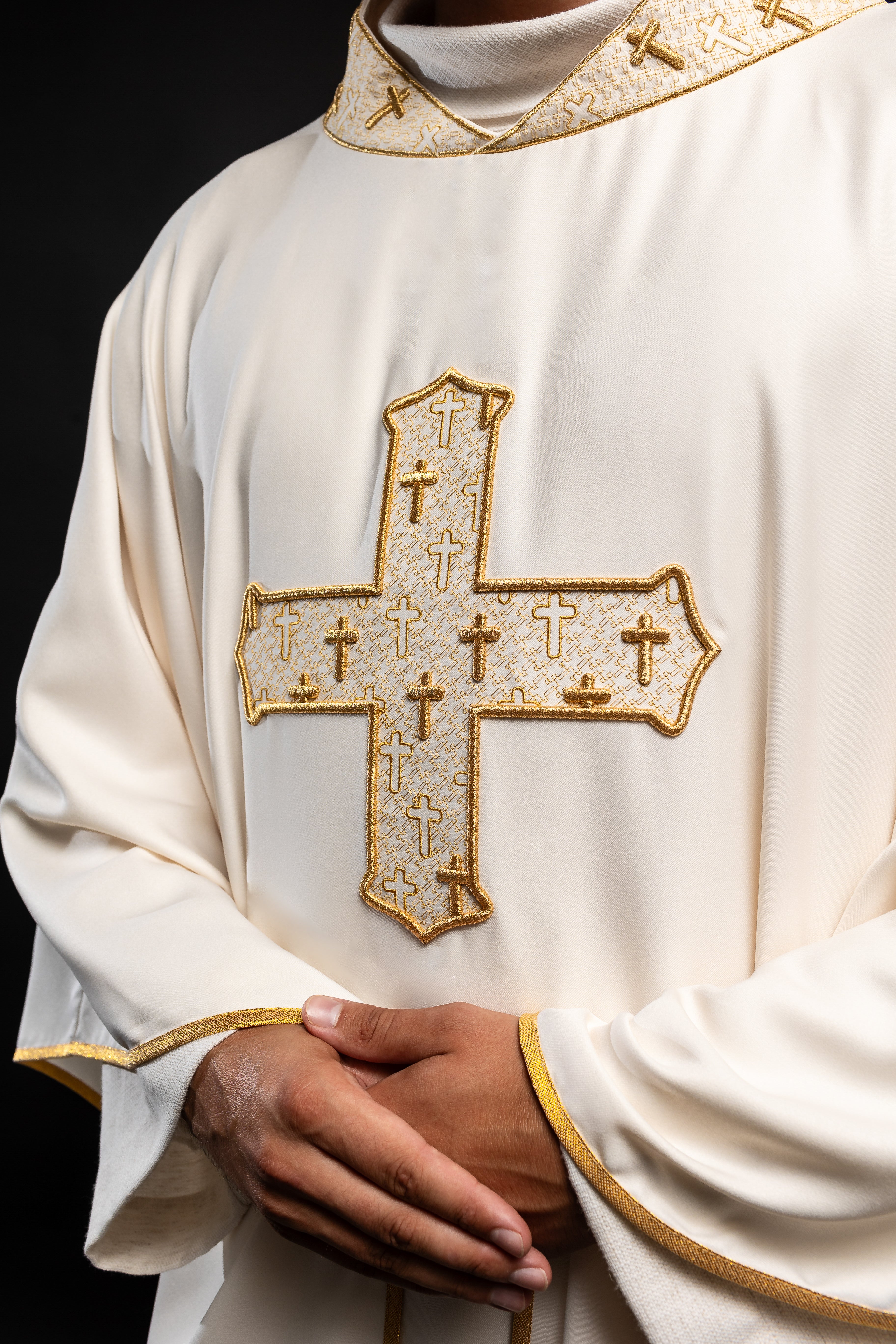 Chasuble made of ecru texture with gold cross embroidery on collar