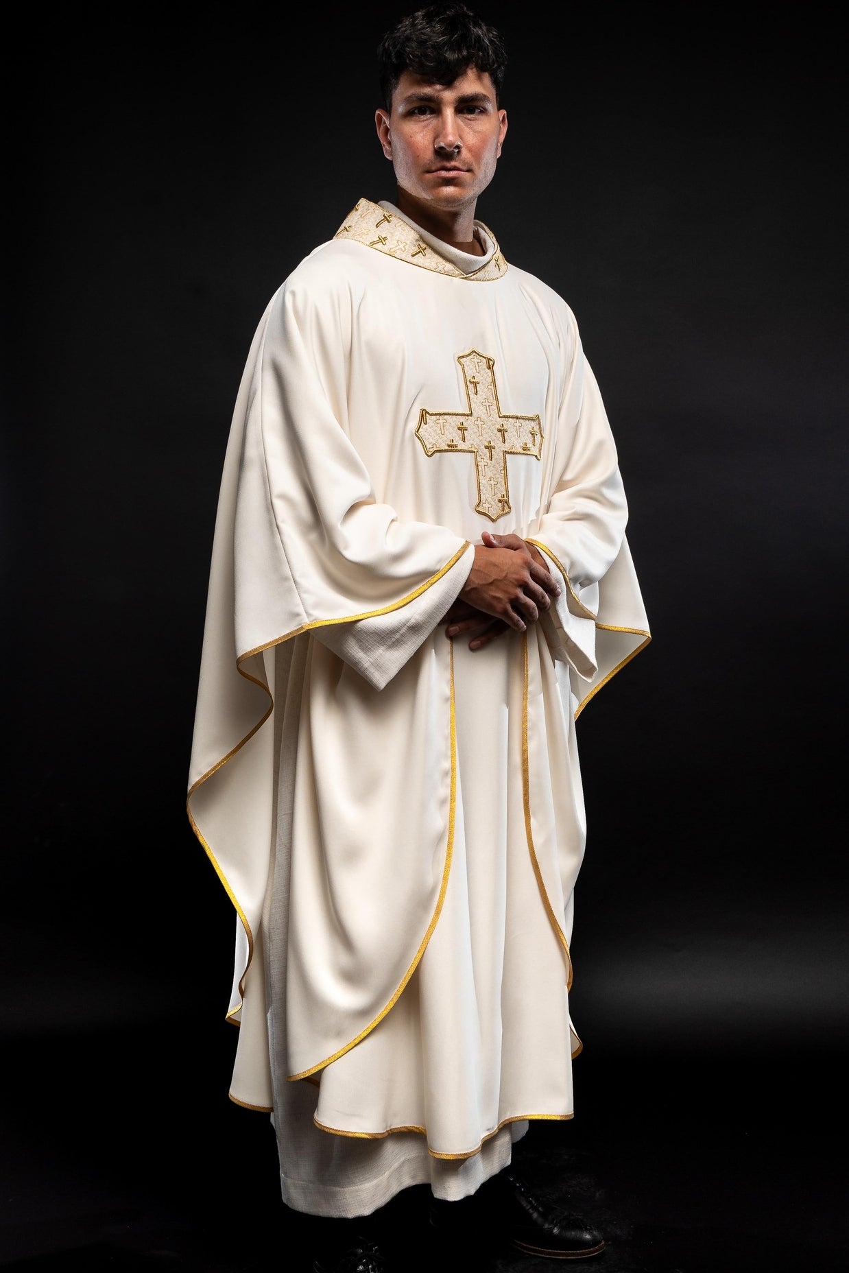 Chasuble made of ecru texture with gold cross embroidery on collar