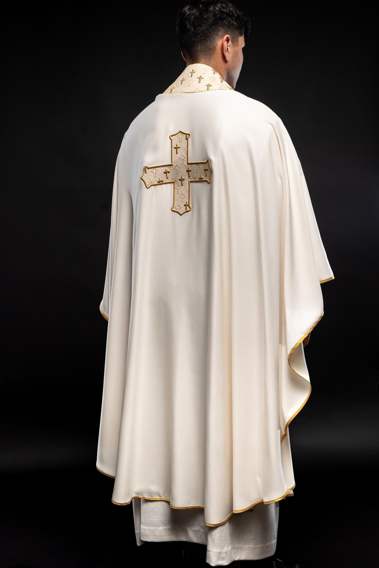 Chasuble made of ecru texture with gold cross embroidery on collar